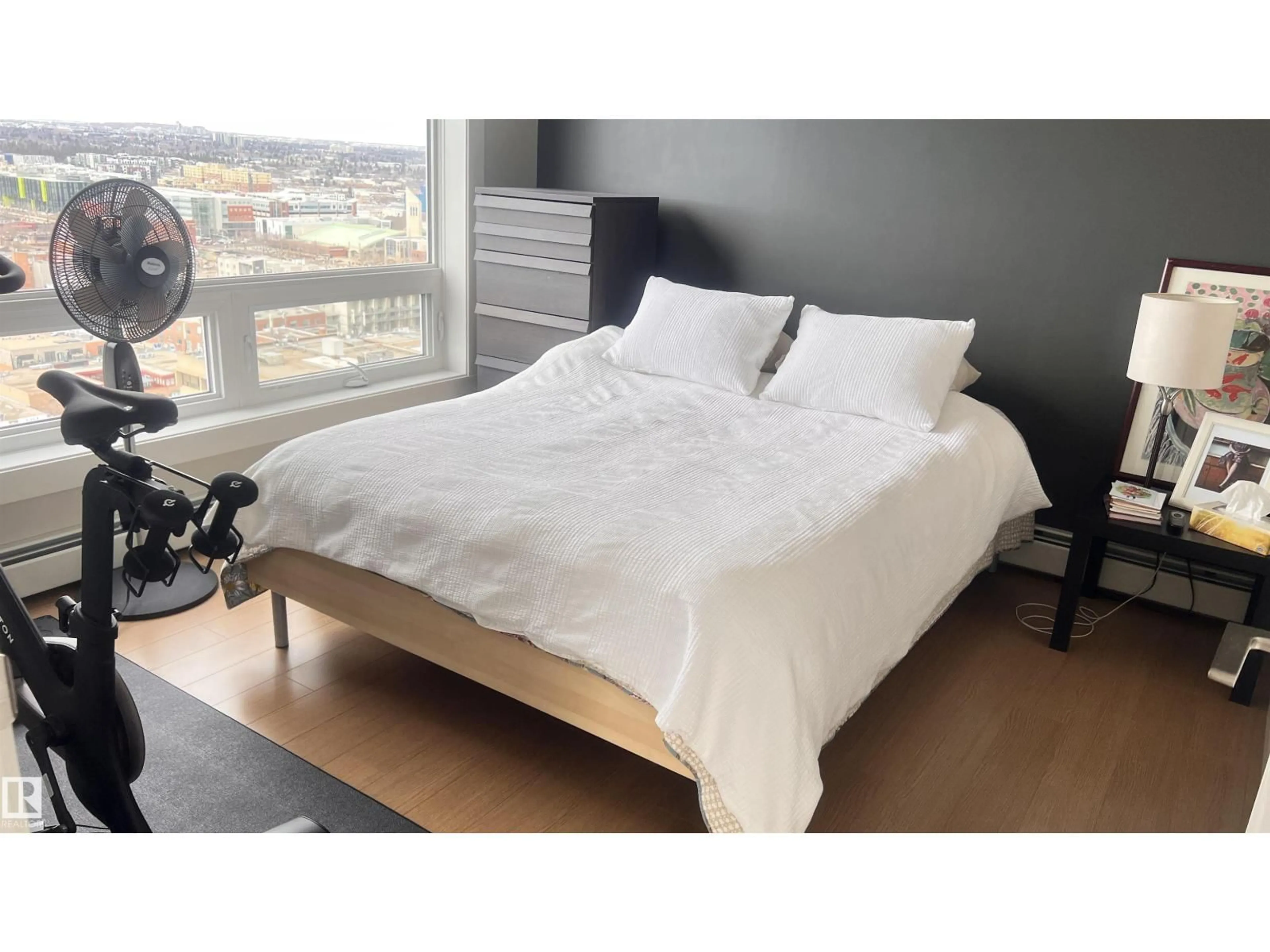 Bedroom with bed, wood/laminate floor for 2004 - 10410 102 AV, Edmonton Alberta T5J0E9