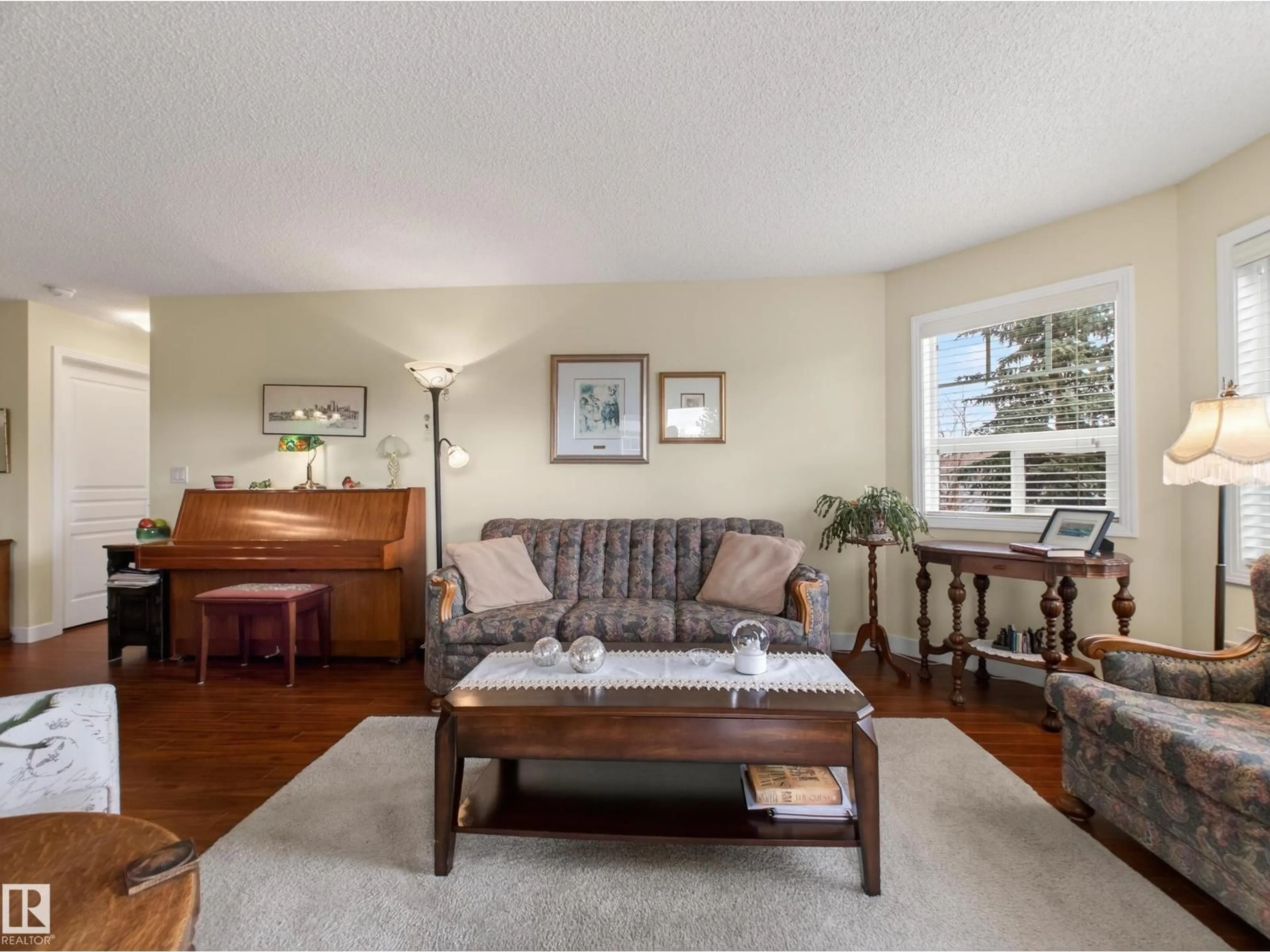 Living room with furniture, wood/laminate floor for #218 - 2045 GRANTHAM CT, Edmonton Alberta T5T3X6