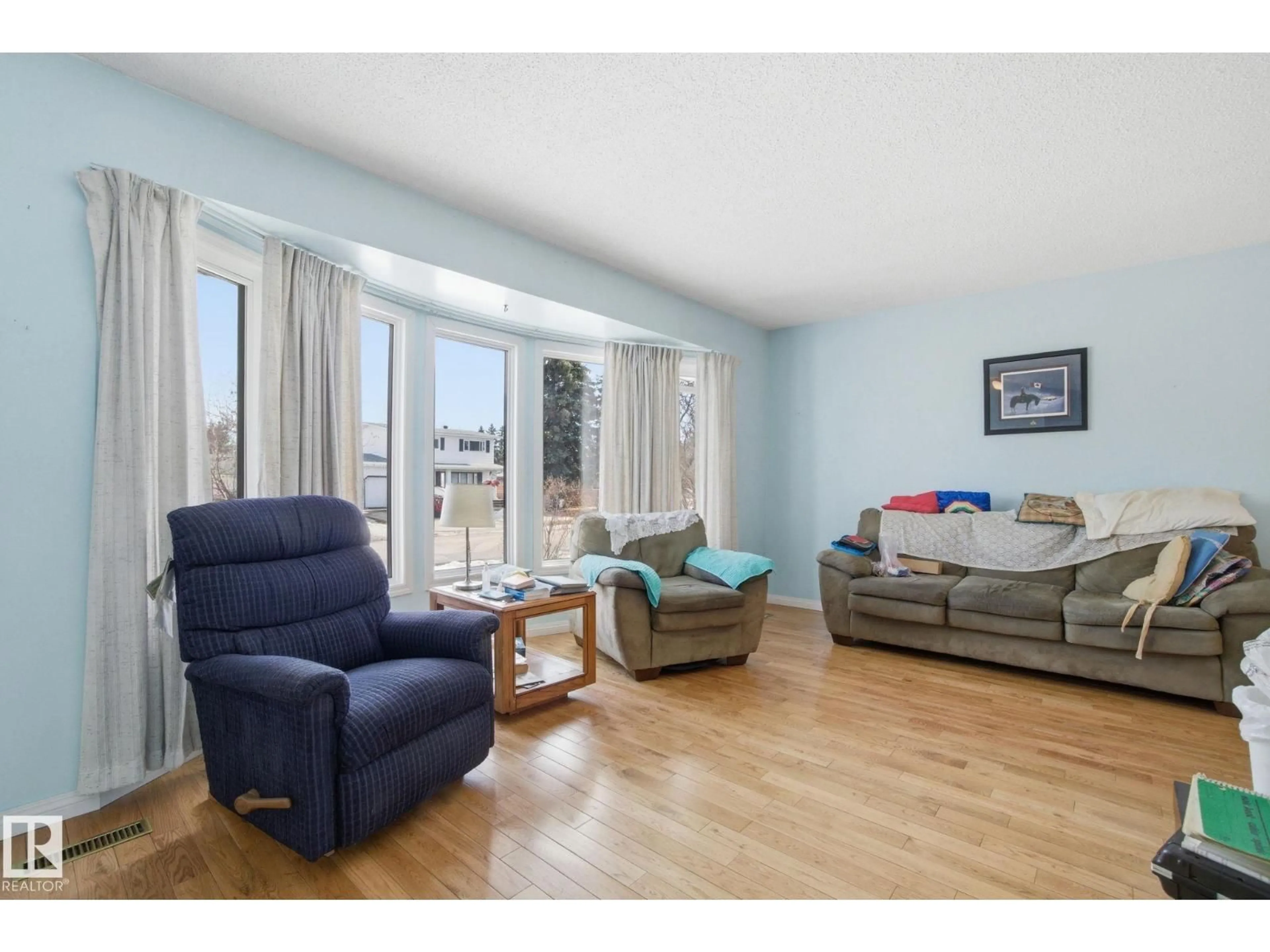 Living room with furniture, wood/laminate floor for 82 WINDERMERE DR, Spruce Grove Alberta T7X1N7