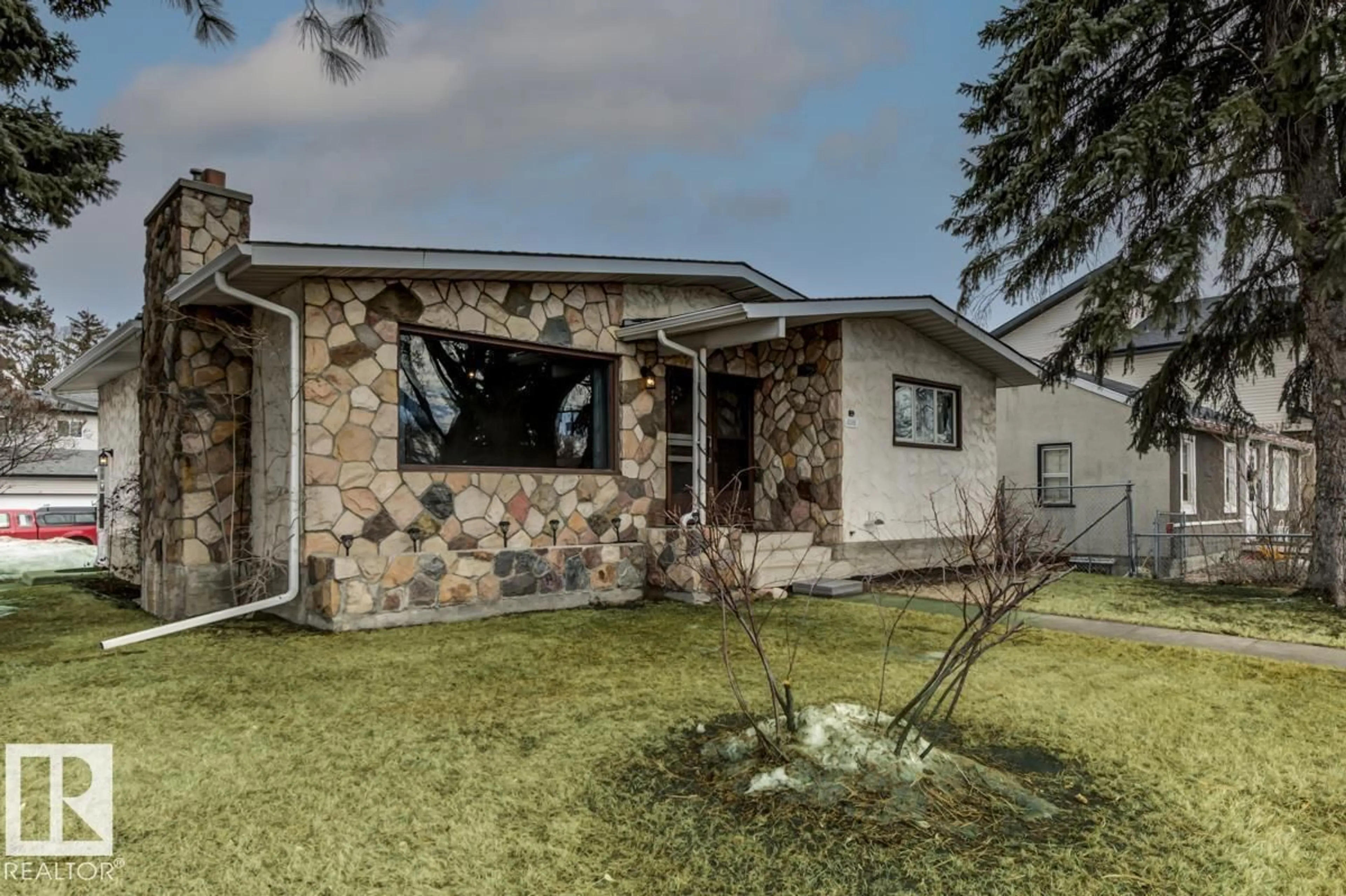 Home with vinyl exterior material, street for 4248 114 AV, Edmonton Alberta T5W0T2