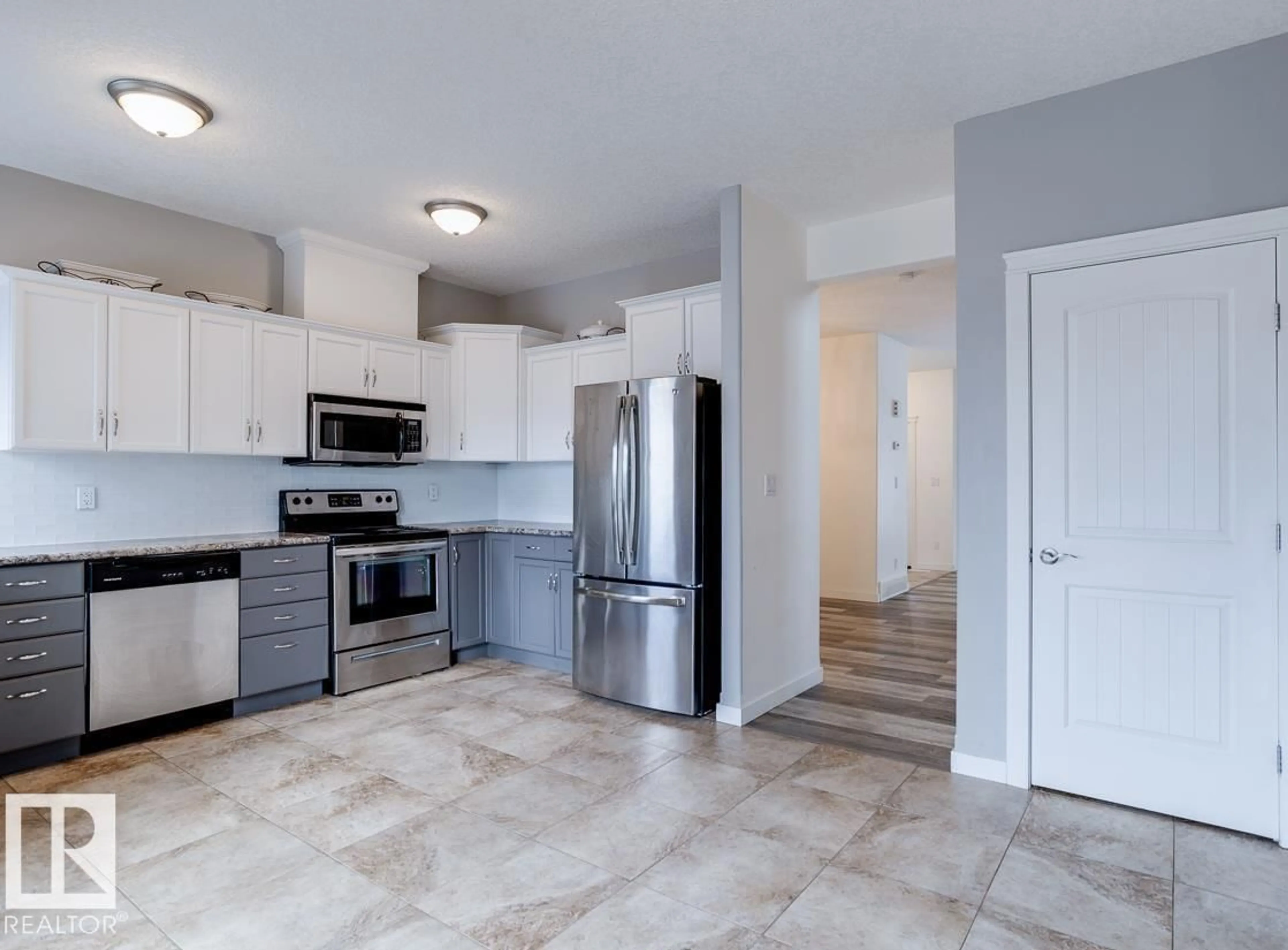 Open concept kitchen, ceramic/tile floor for A & B - 4421 46A AV, Leduc Alberta T9E5V5