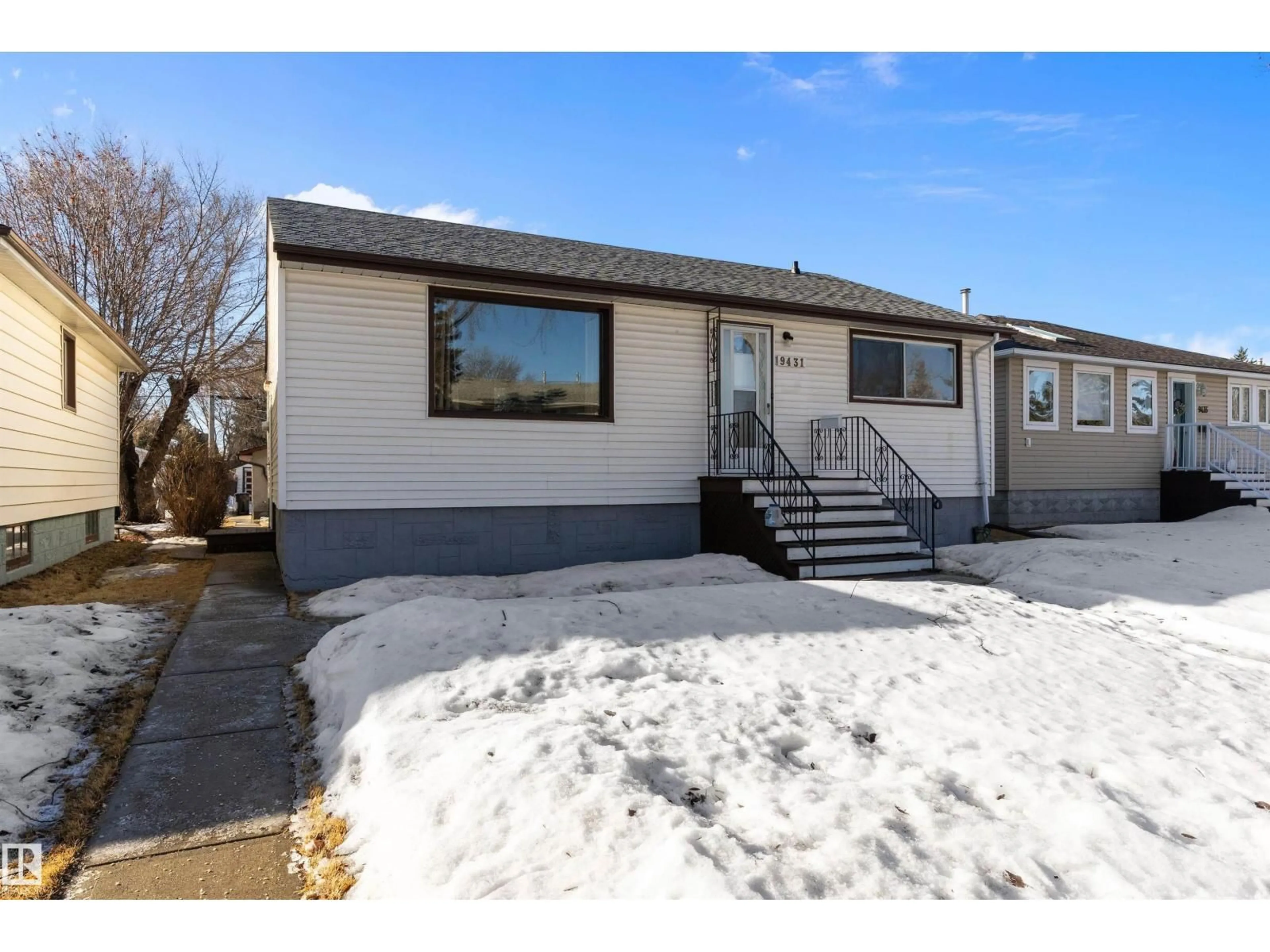 Home with vinyl exterior material, street for 9431 65 AV, Edmonton Alberta T6E0K1