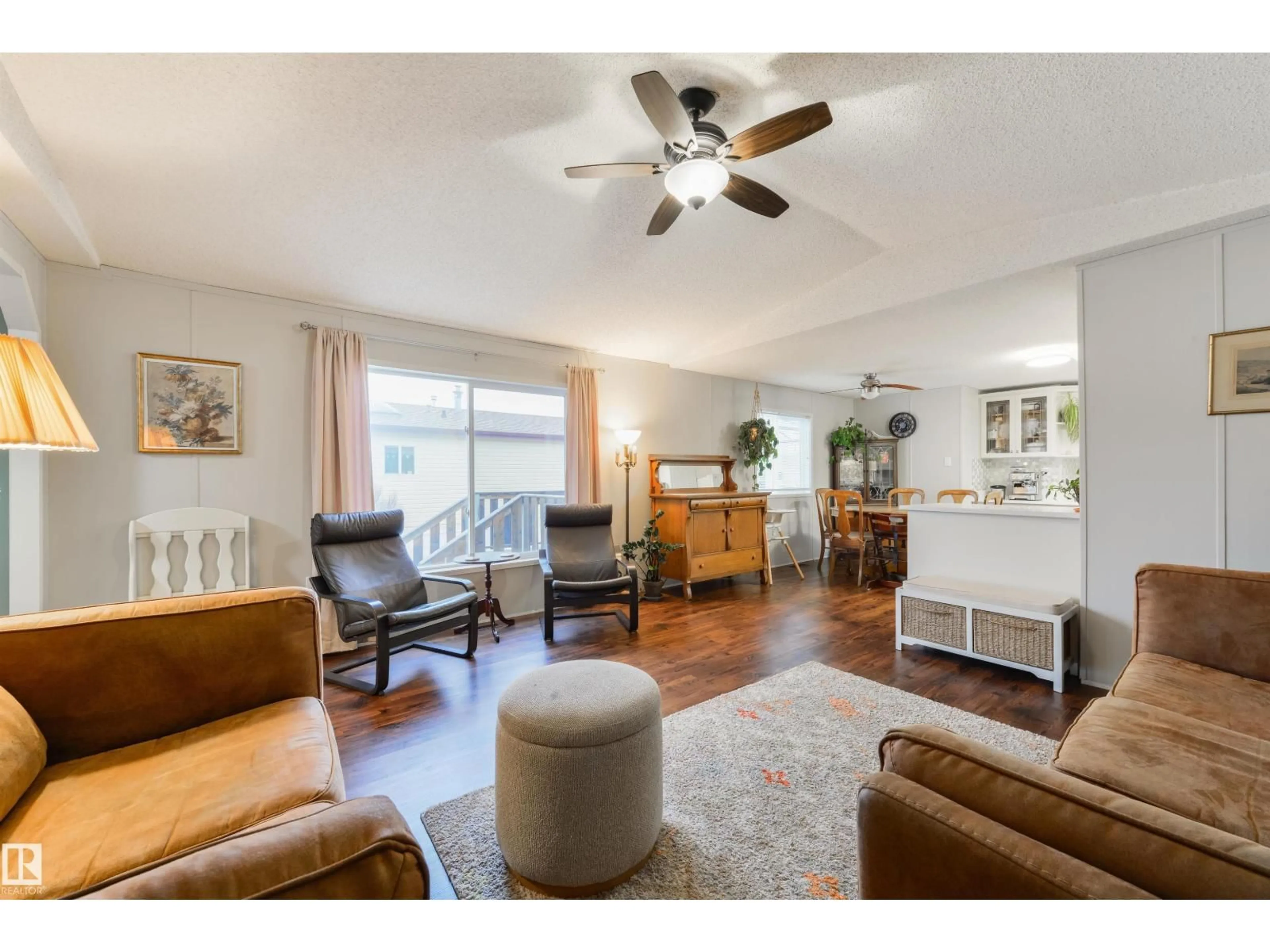 Living room with furniture, wood/laminate floor for 172 3400 48 ST, Stony Plain Alberta T7Z1S1