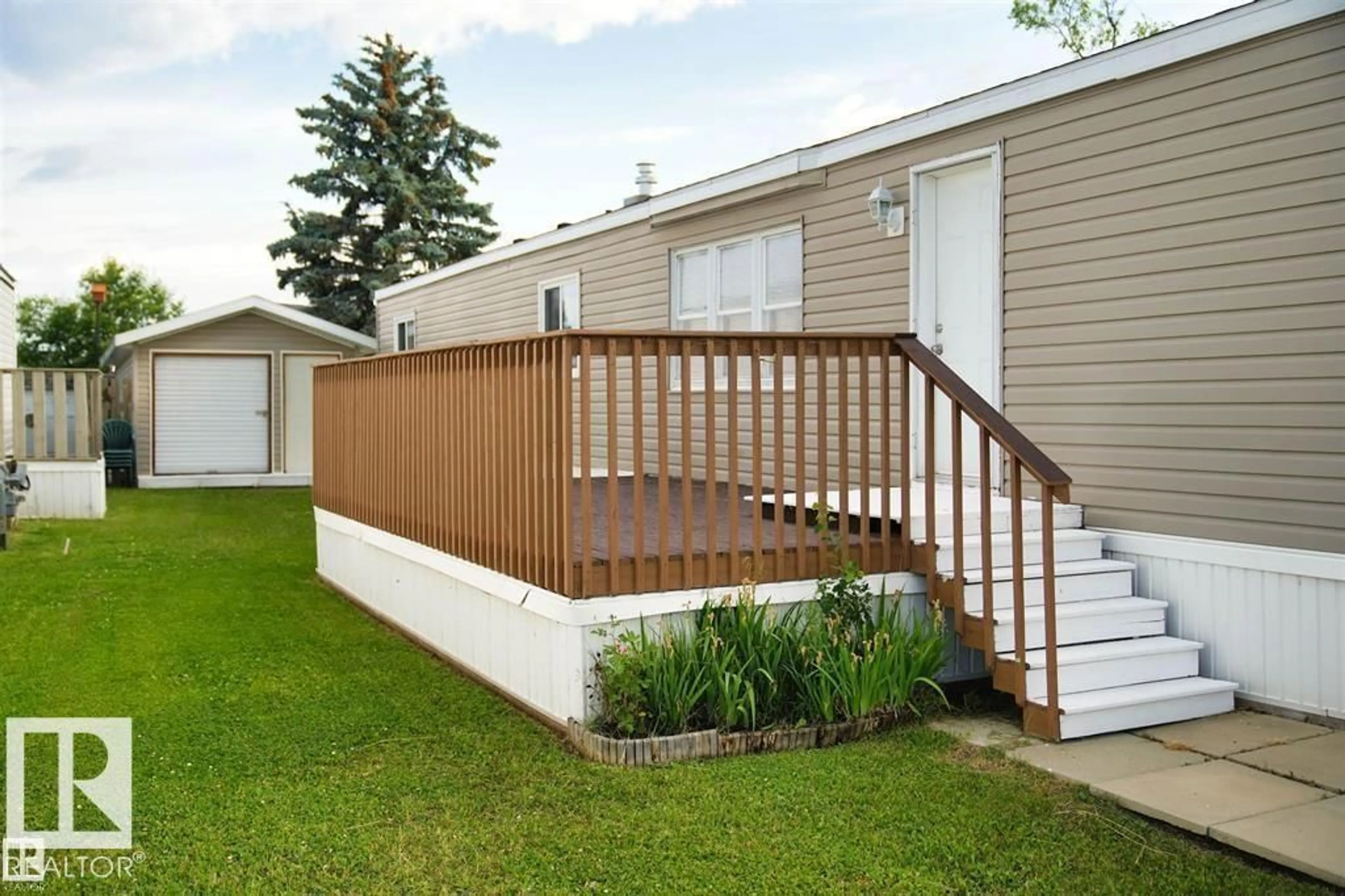Home with vinyl exterior material, street for 110 - 4819 51 AV, Millet Alberta T0C1Z0