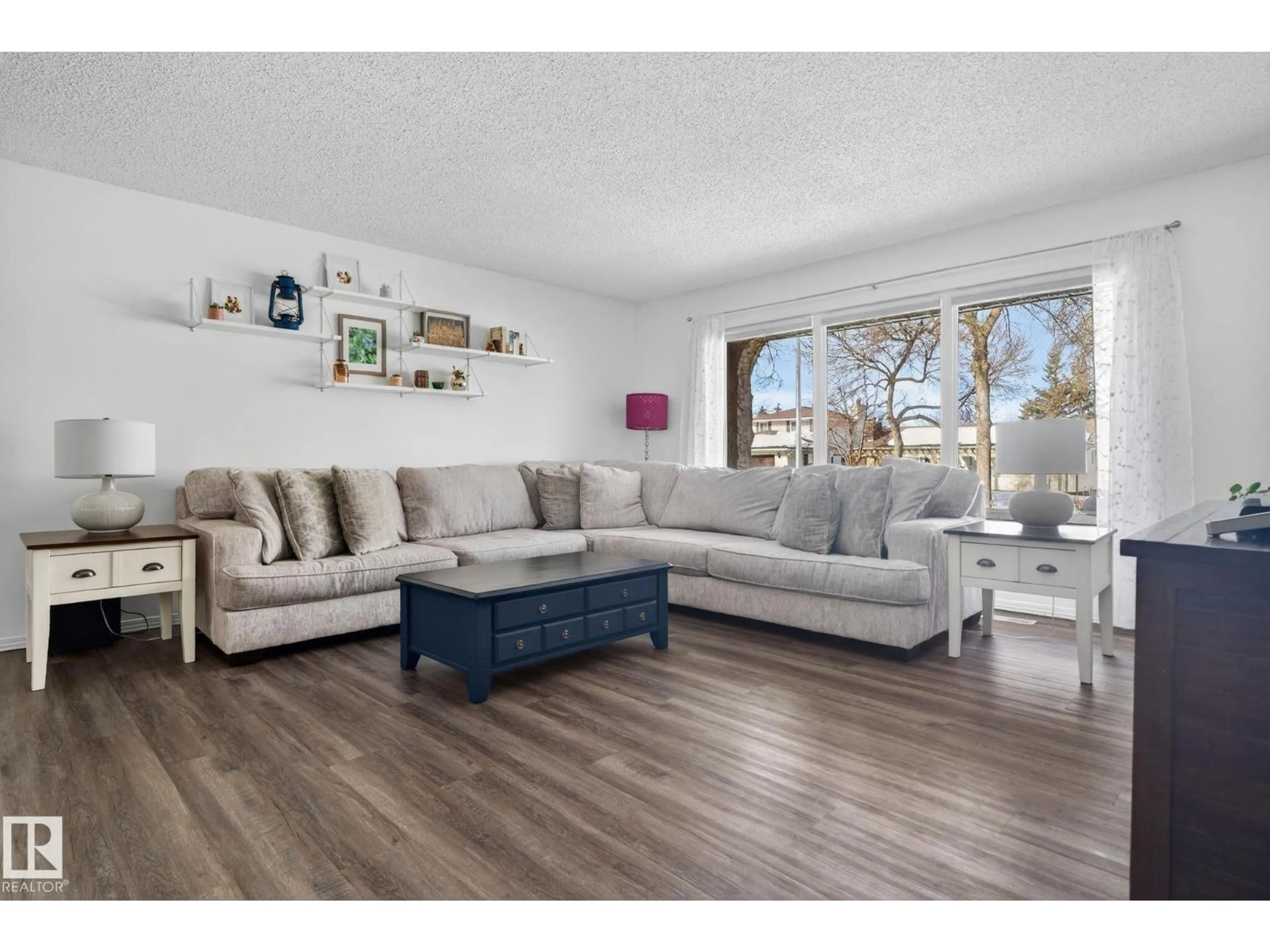 Living room with furniture, wood/laminate floor for 10 BEAVERBROOK CR, St. Albert Alberta T8N2K8