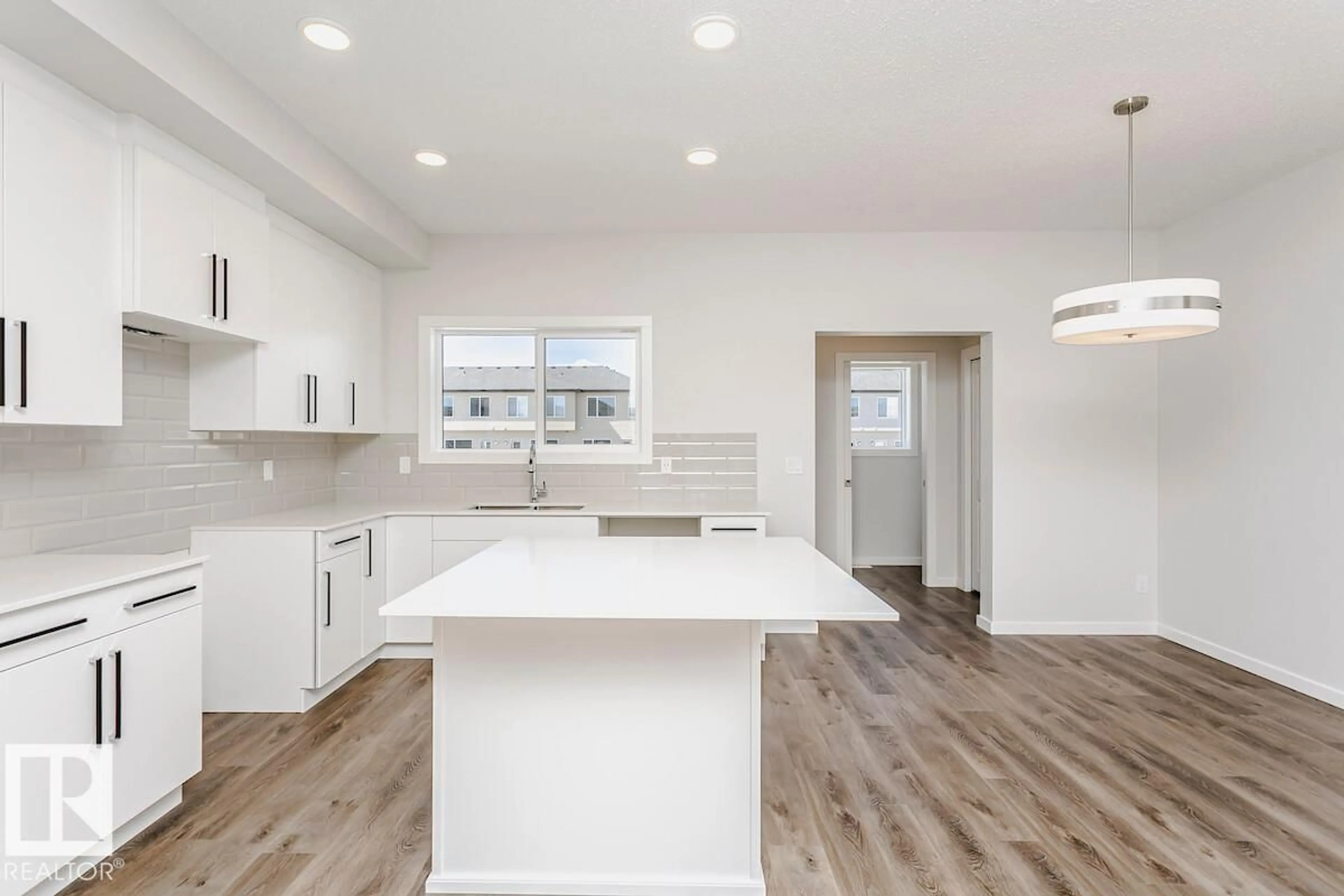 Open concept kitchen, wood/laminate floor for 59 GAMBEL LO, Spruce Grove Alberta T7X0C9