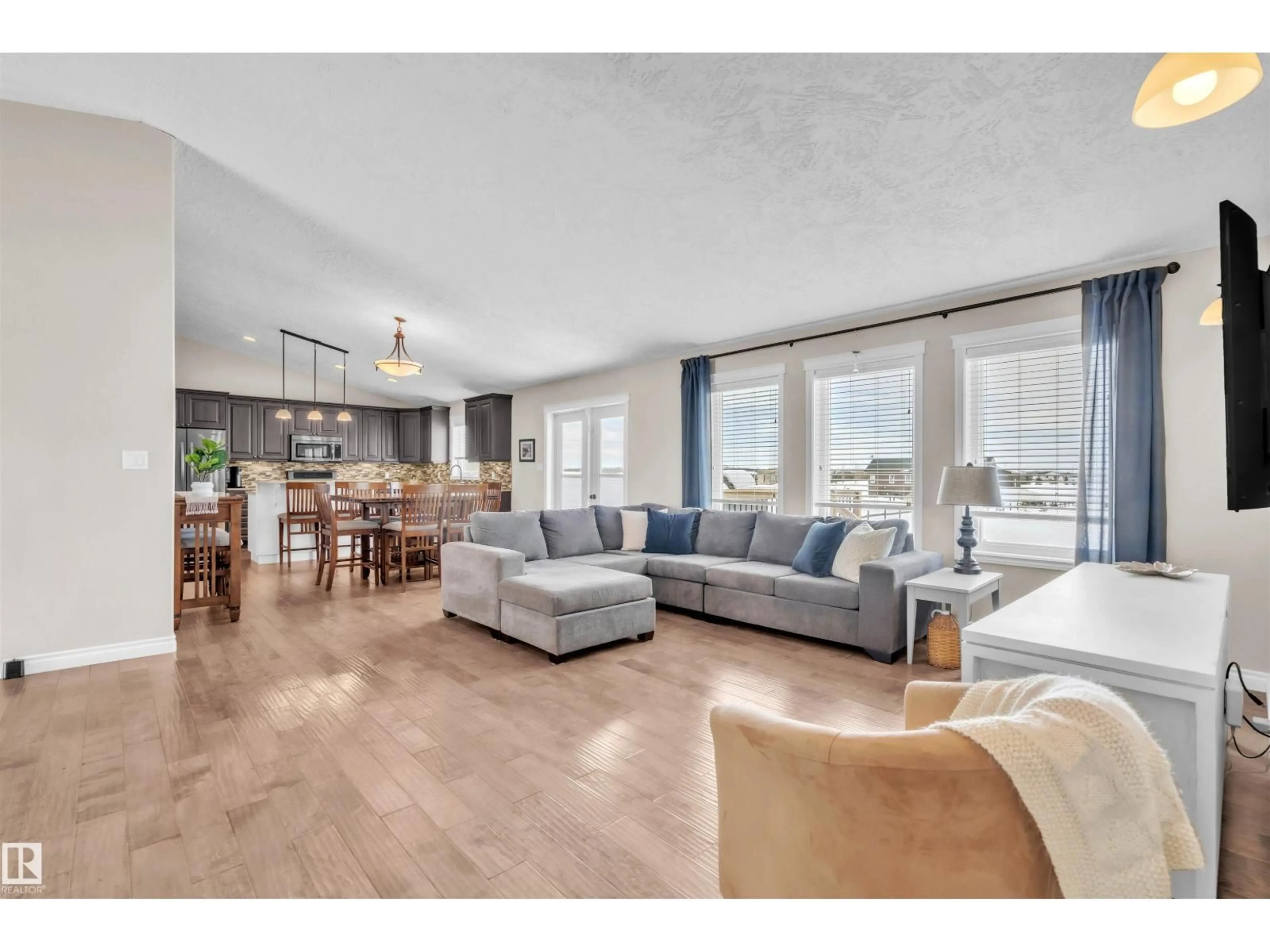 Living room with furniture, wood/laminate floor for 63210 RGE RD 423, Rural Bonnyville M.D. Alberta T9M1N2