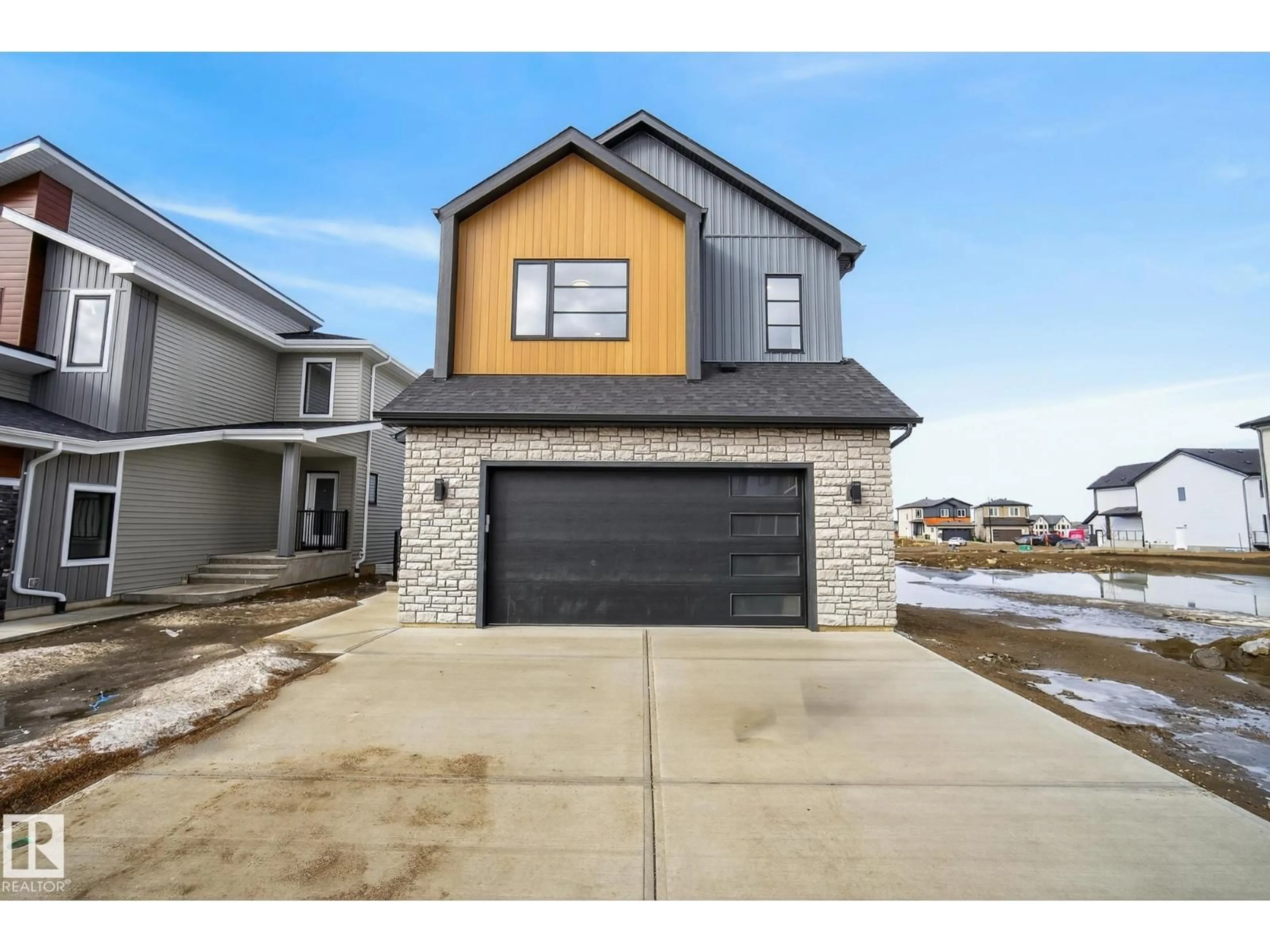 Home with brick exterior material, street for 7087 KIVIAQ CR, Edmonton Alberta T6W5N7