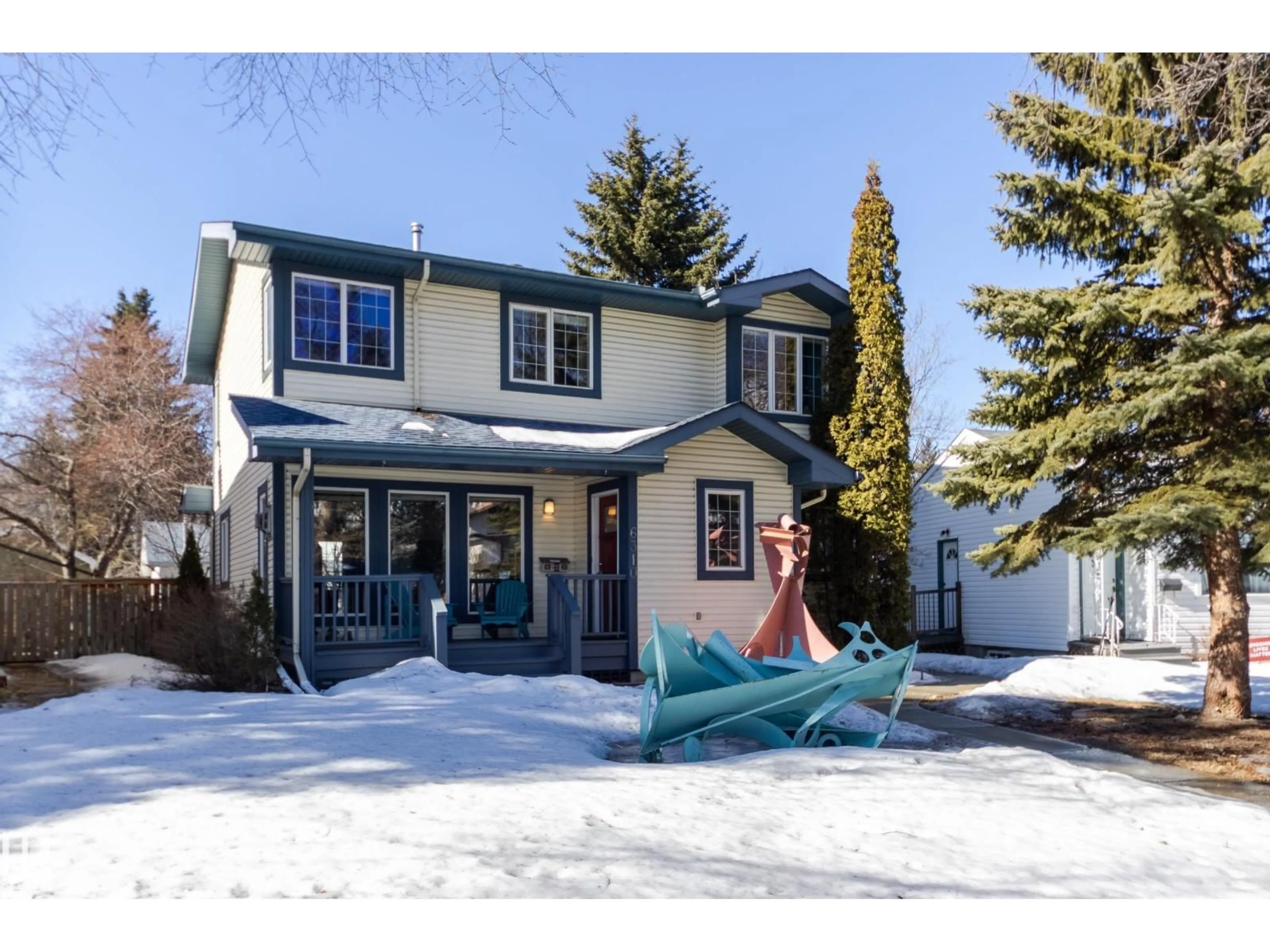 Home with vinyl exterior material, street for 6310 112 ST, Edmonton Alberta T6H3J6