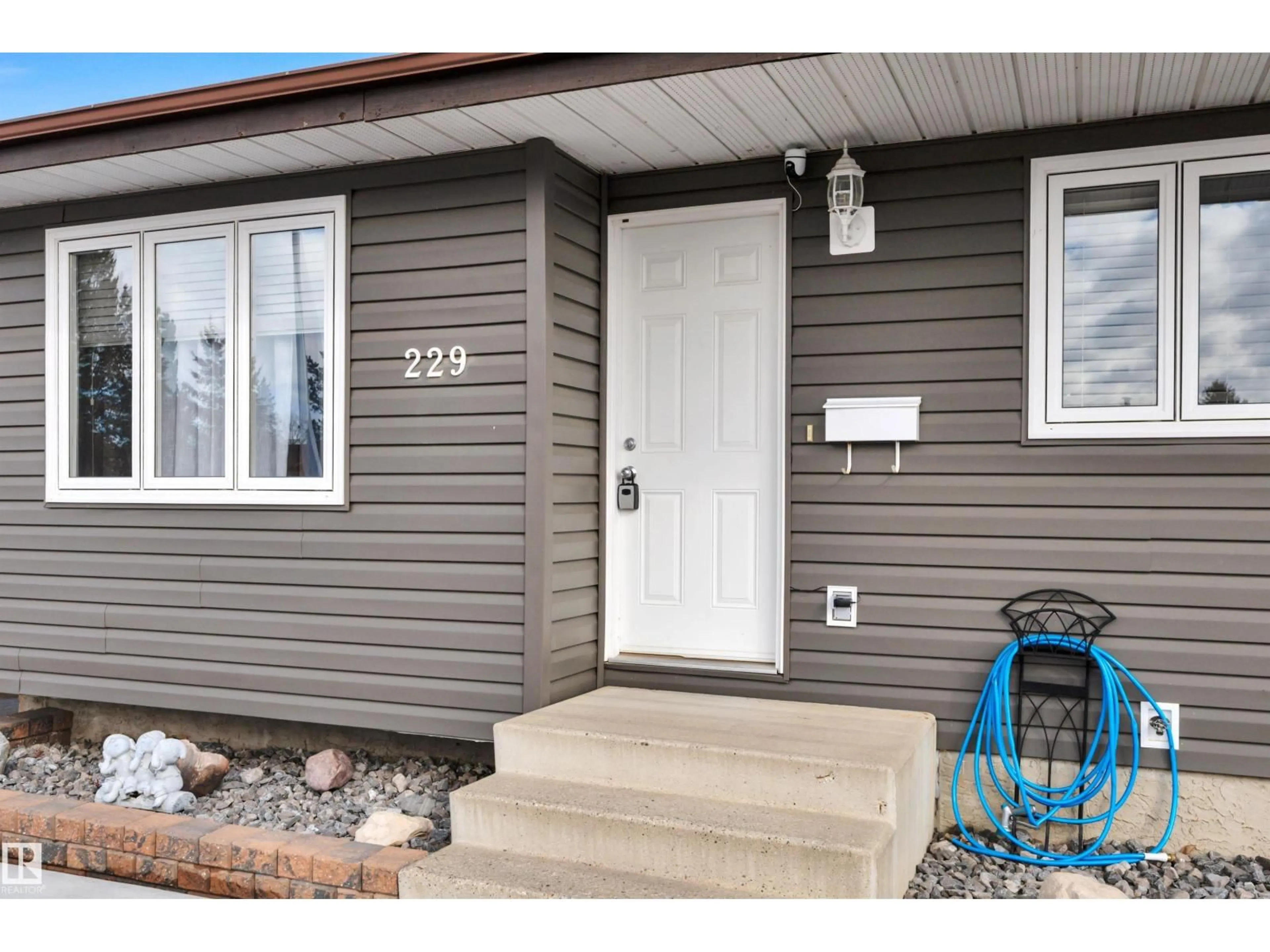 Home with vinyl exterior material, street for 229 GARNET CR, Wetaskiwin Alberta T9A2S3