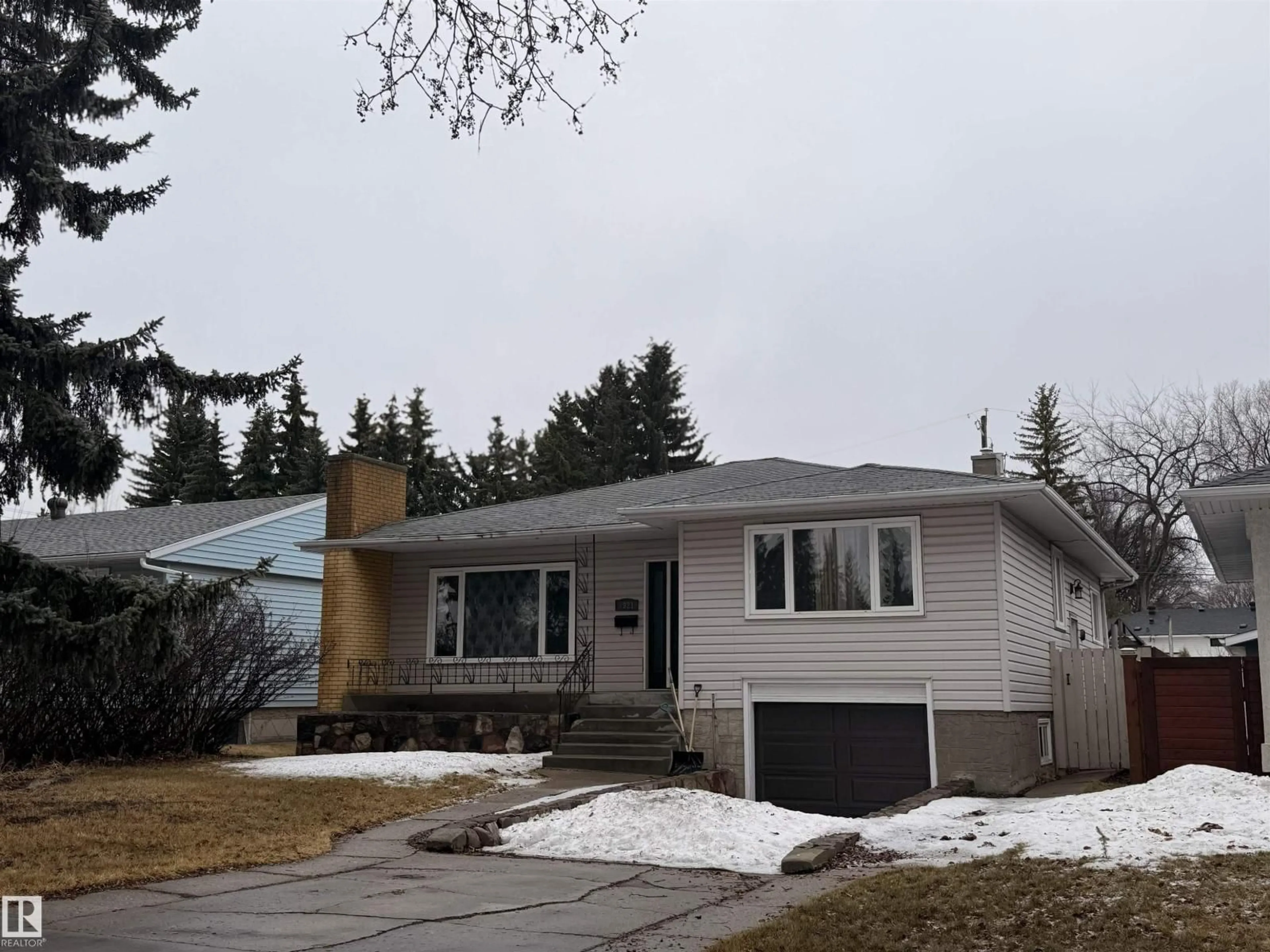 Home with vinyl exterior material, street for 7921 97 AV, Edmonton Alberta T6C2B6