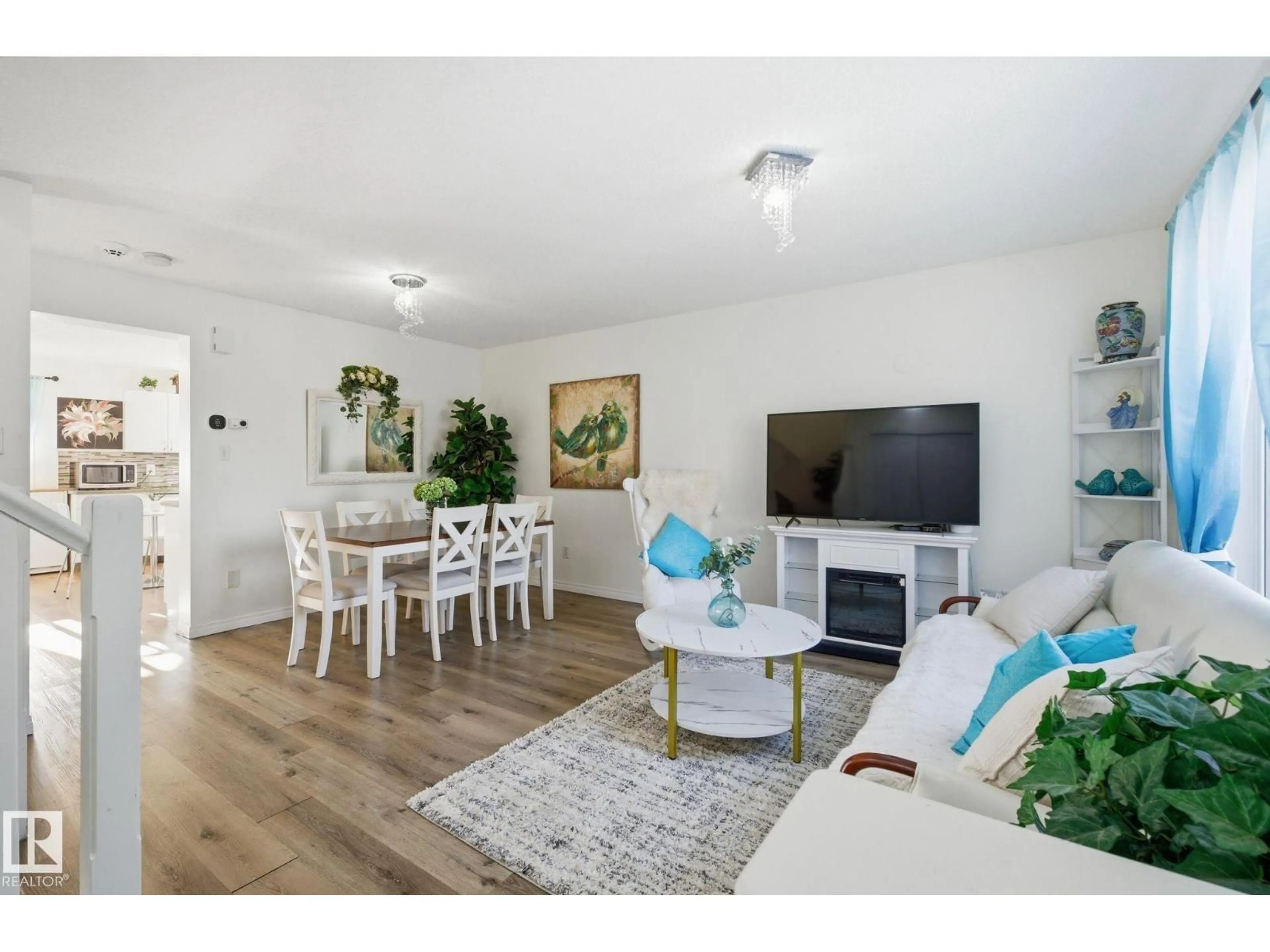 Living room with furniture, wood/laminate floor for 7032 SOUTH TERWILLEGAR DR, Edmonton Alberta T6R3V7