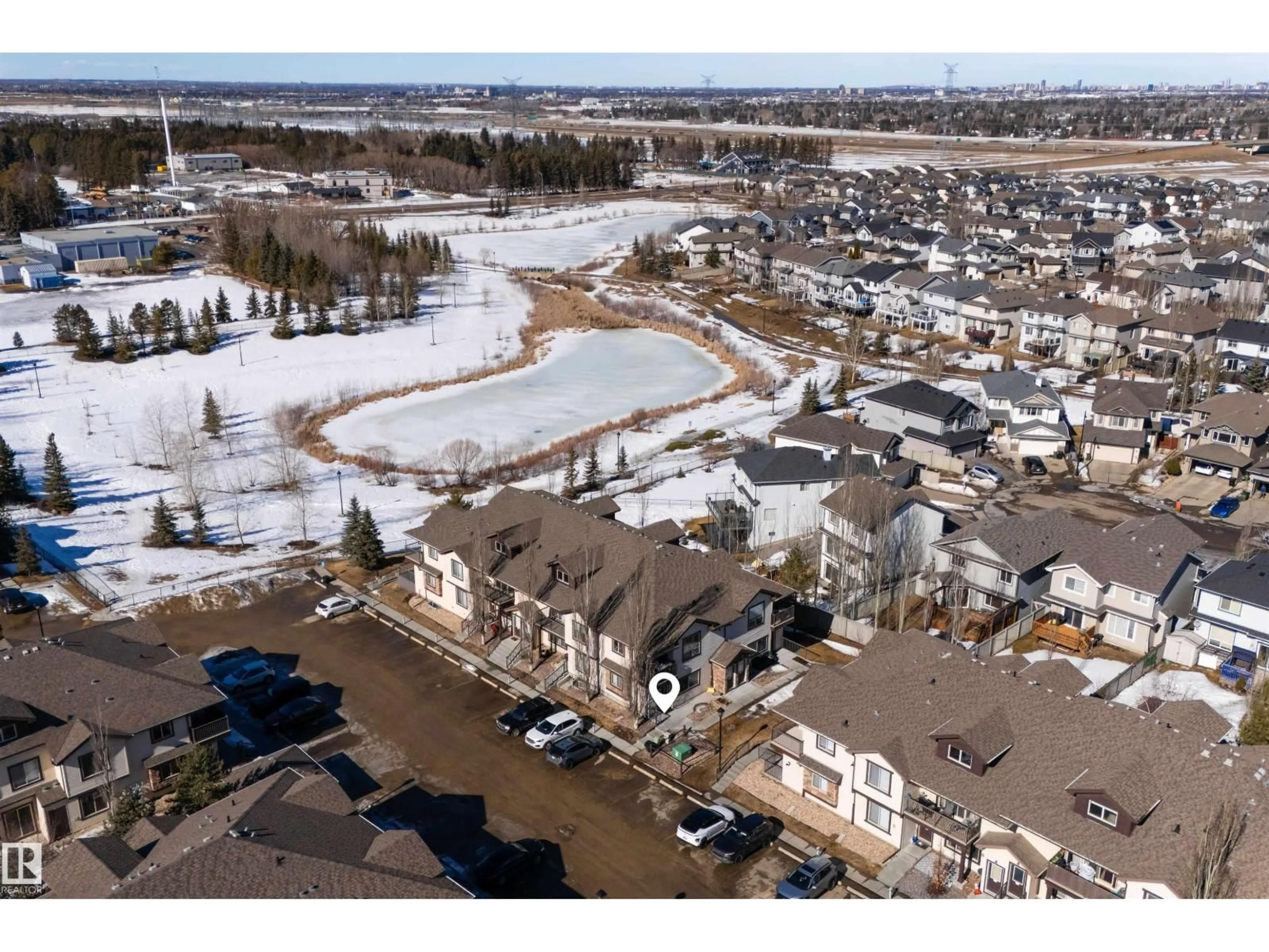 A pic from outside/outdoor area/front of a property/back of a property/a pic from drone, water/lake/river/ocean view for 16 604 62 ST SW, Edmonton Alberta T6X0K4