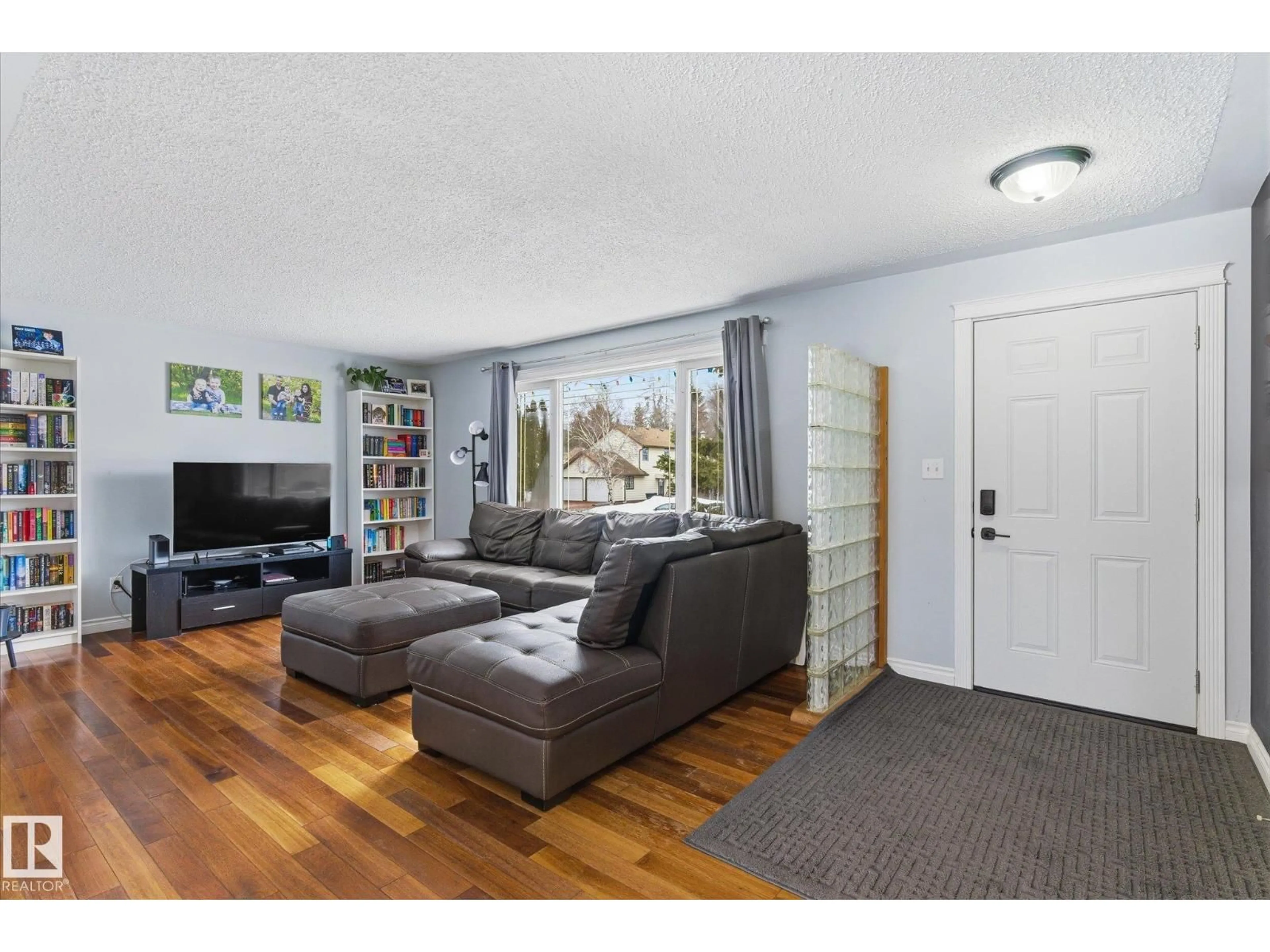 Living room with furniture, wood/laminate floor for 5312 50 AV, Bon Accord Alberta T0A0K0