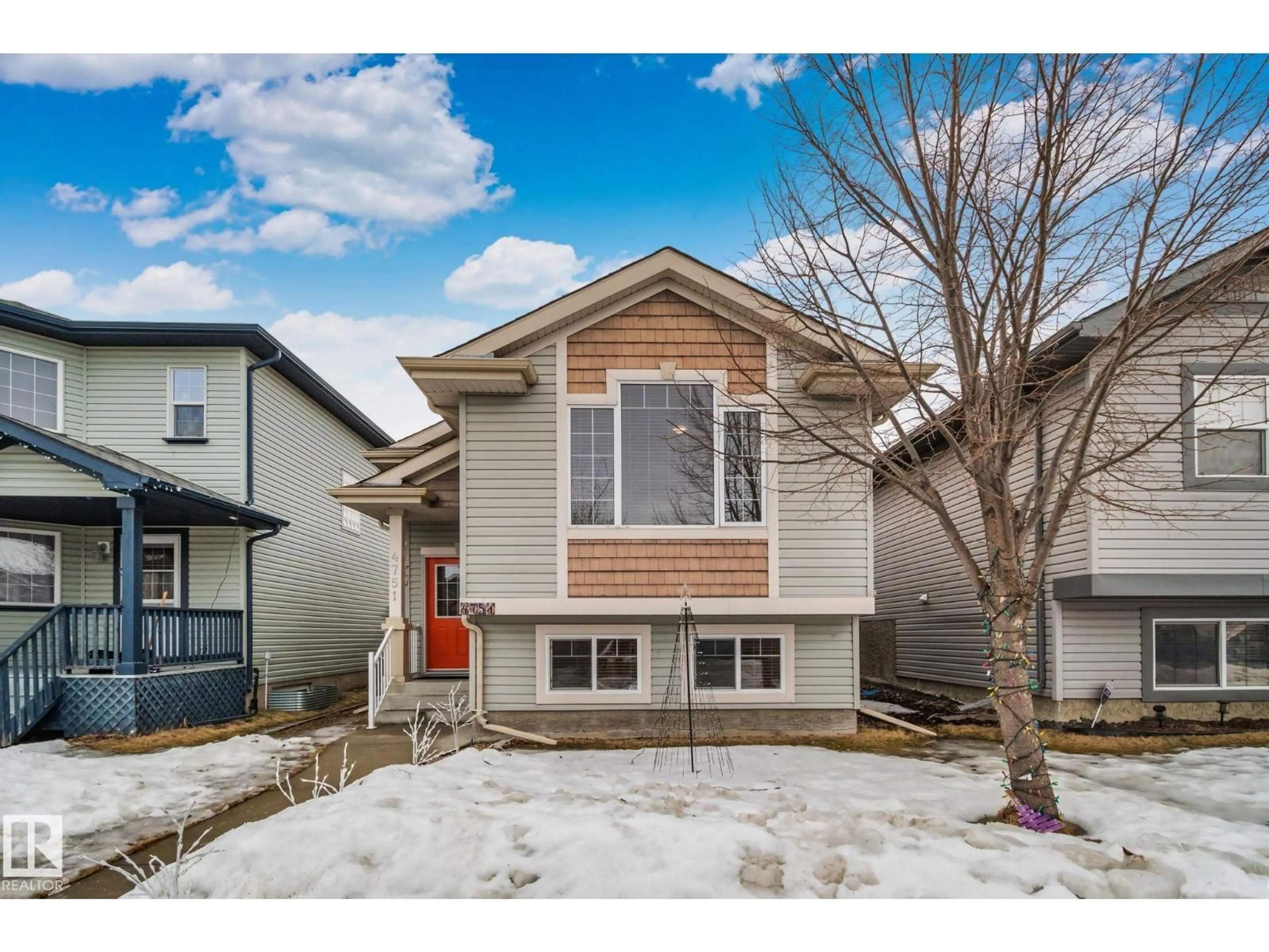 Home with vinyl exterior material, street for 4751 156 AV, Edmonton Alberta T5Y0B6