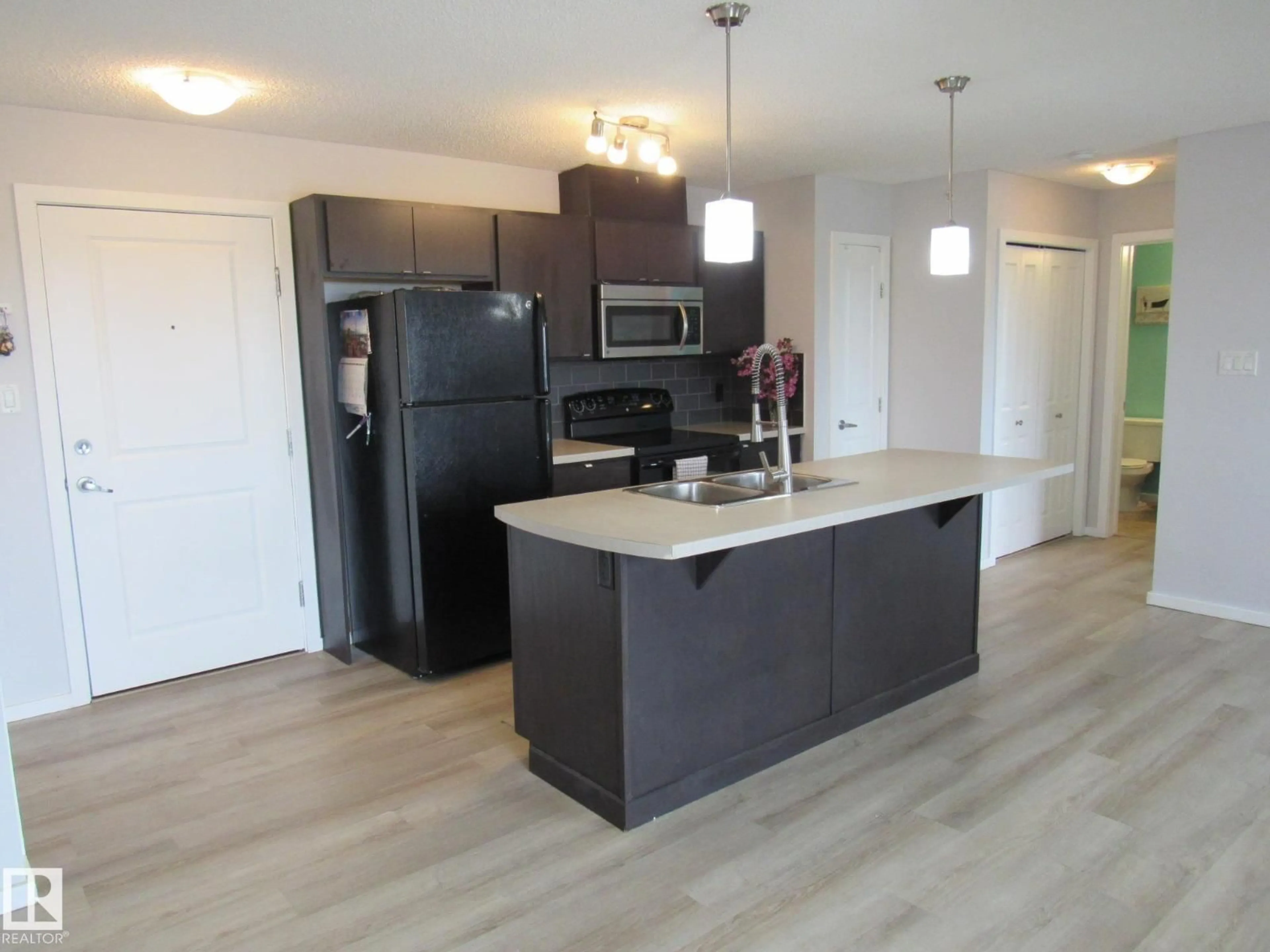 Open concept kitchen, unknown for #453 - 1196 HYNDMAN RD, Edmonton Alberta T5A0X8