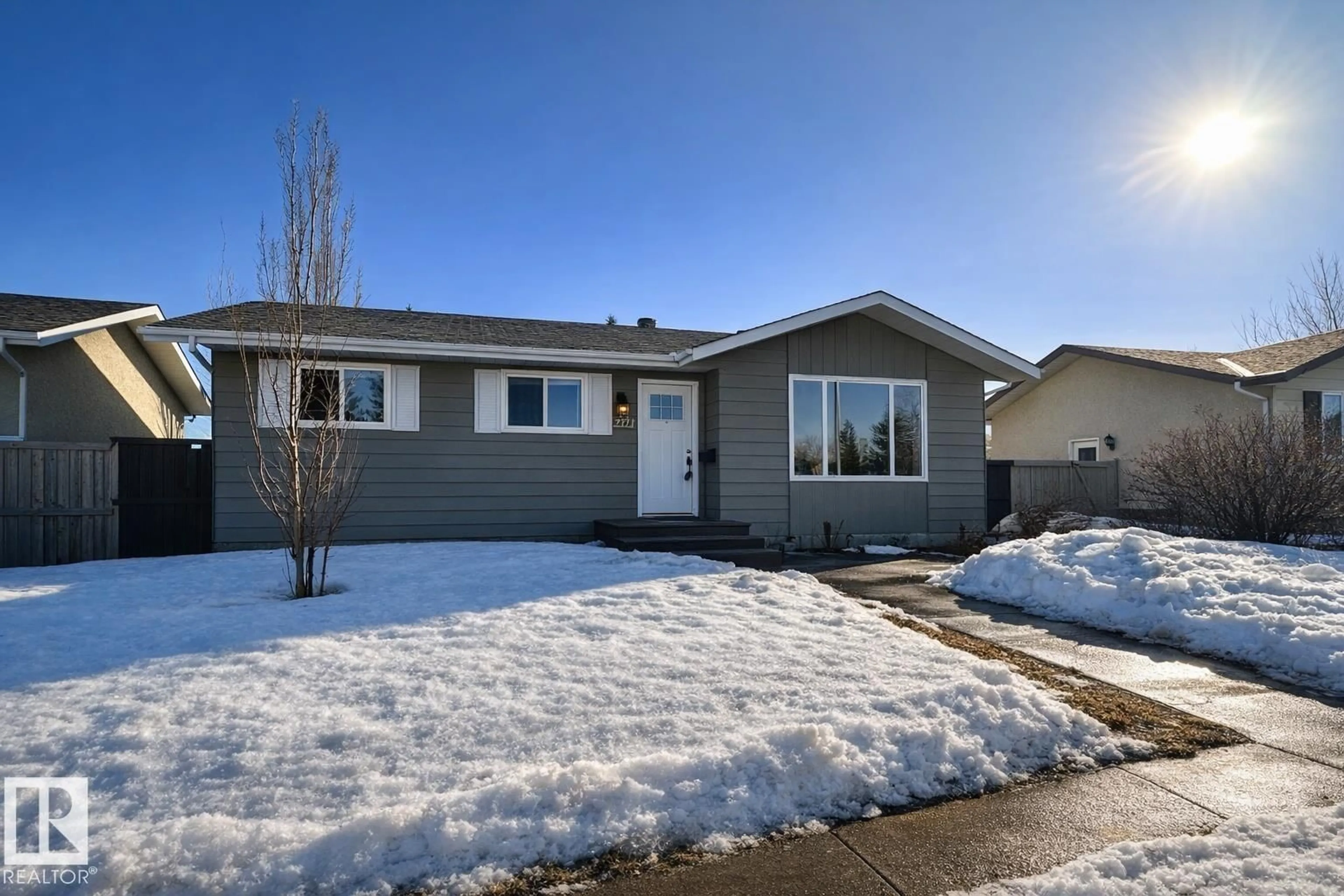 Home with vinyl exterior material, street for 2111 146 AV, Edmonton Alberta T5Y1T6