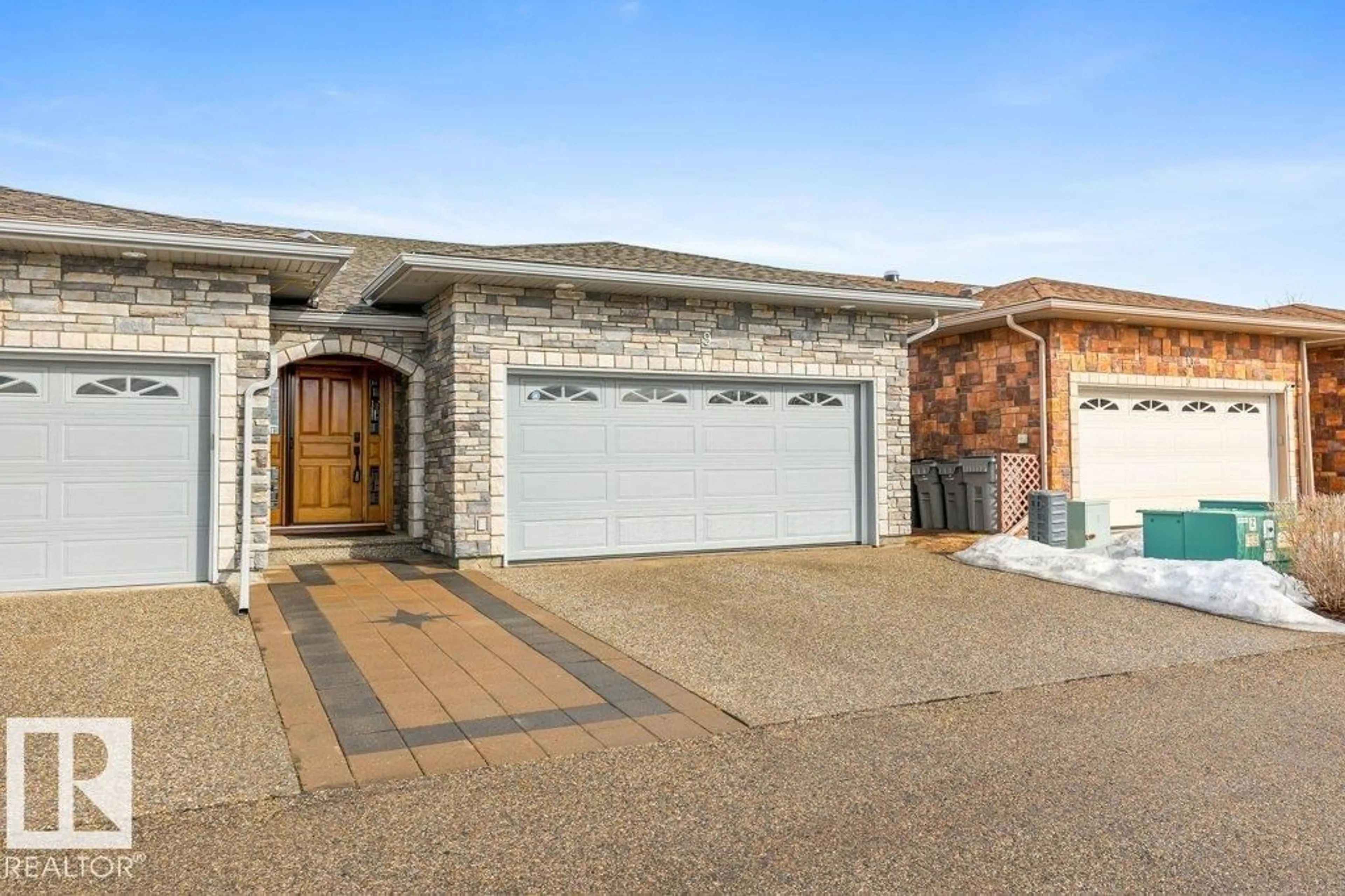Home with brick exterior material, street for 9 - 10500 103 AV, Morinville Alberta T8R0E7