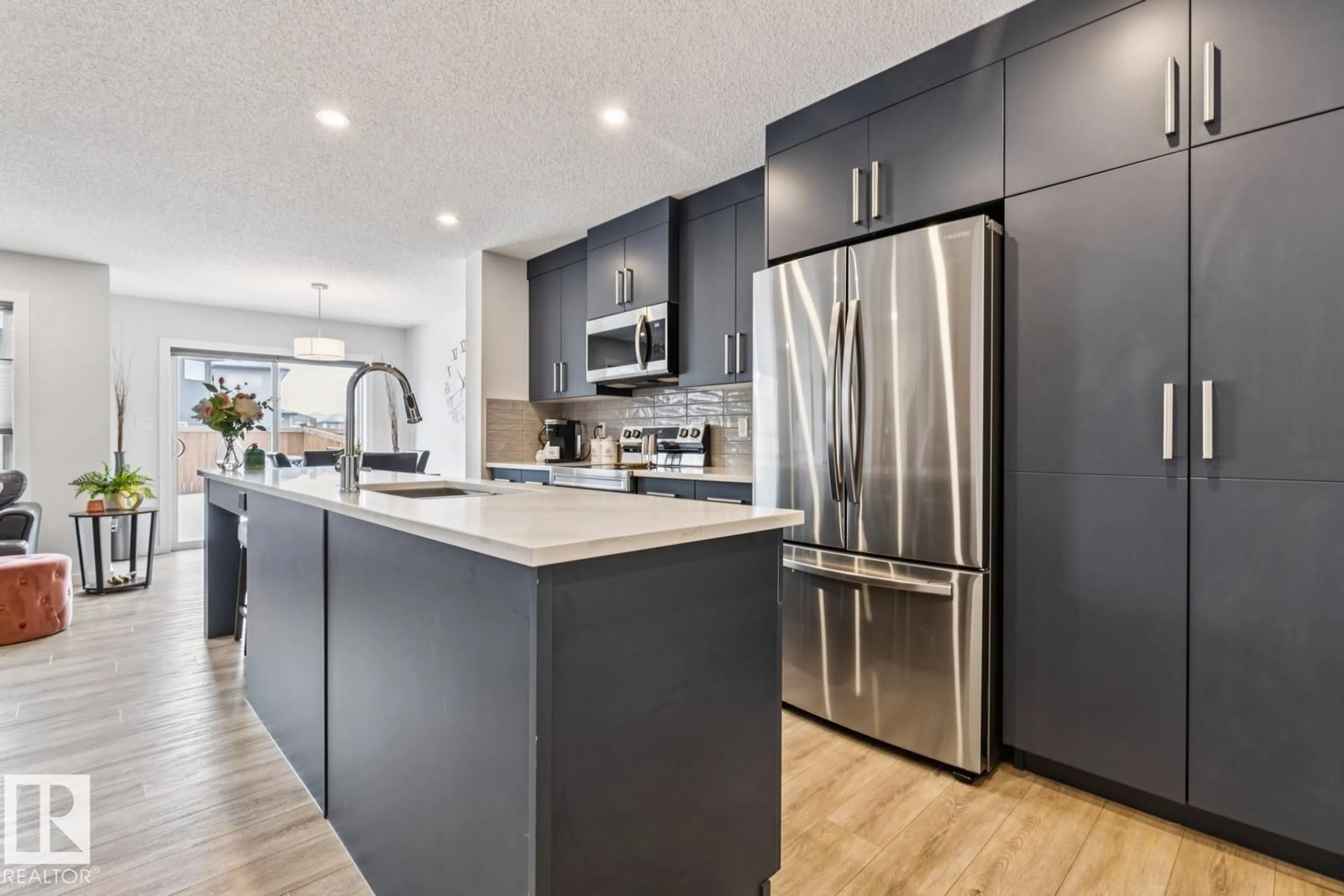 Open concept kitchen, wood/laminate floor for SW - 9317 PEAR LINK LI, Edmonton Alberta T6X2V9