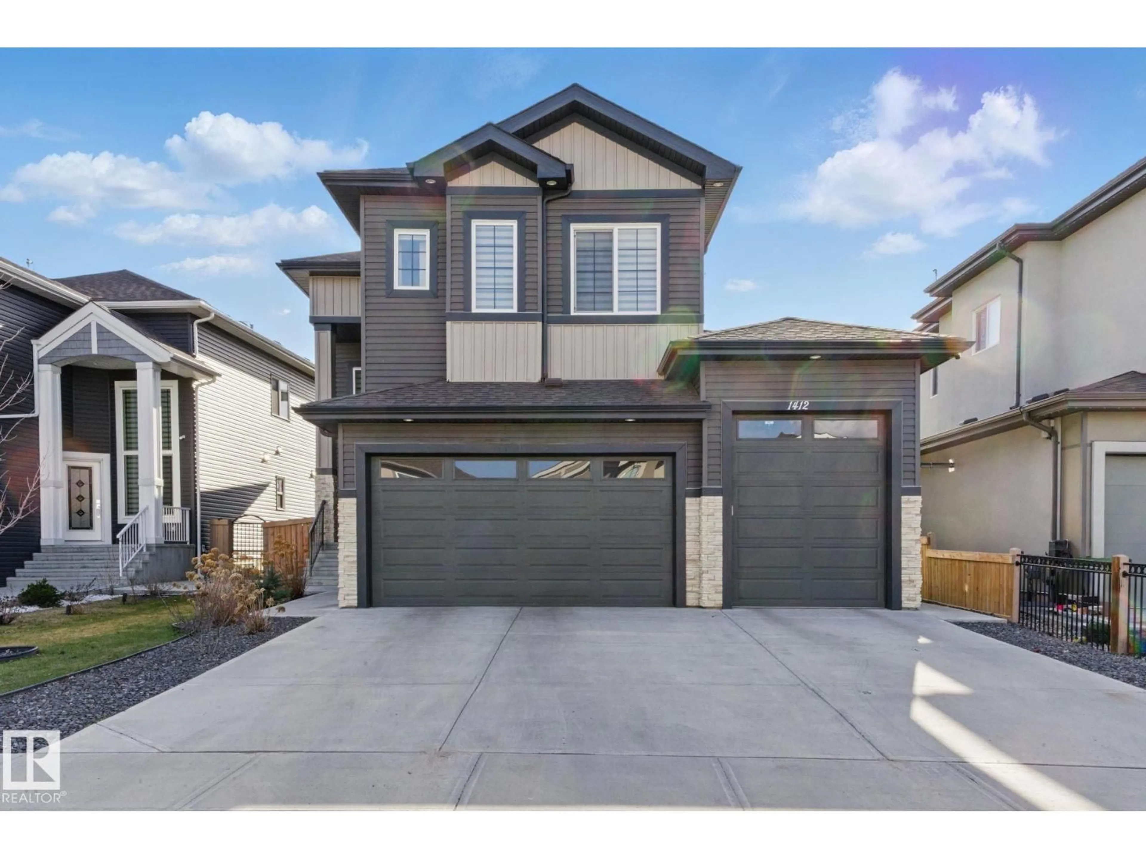 Home with vinyl exterior material, street for 1412 25 ST, Edmonton Alberta T6T2K7