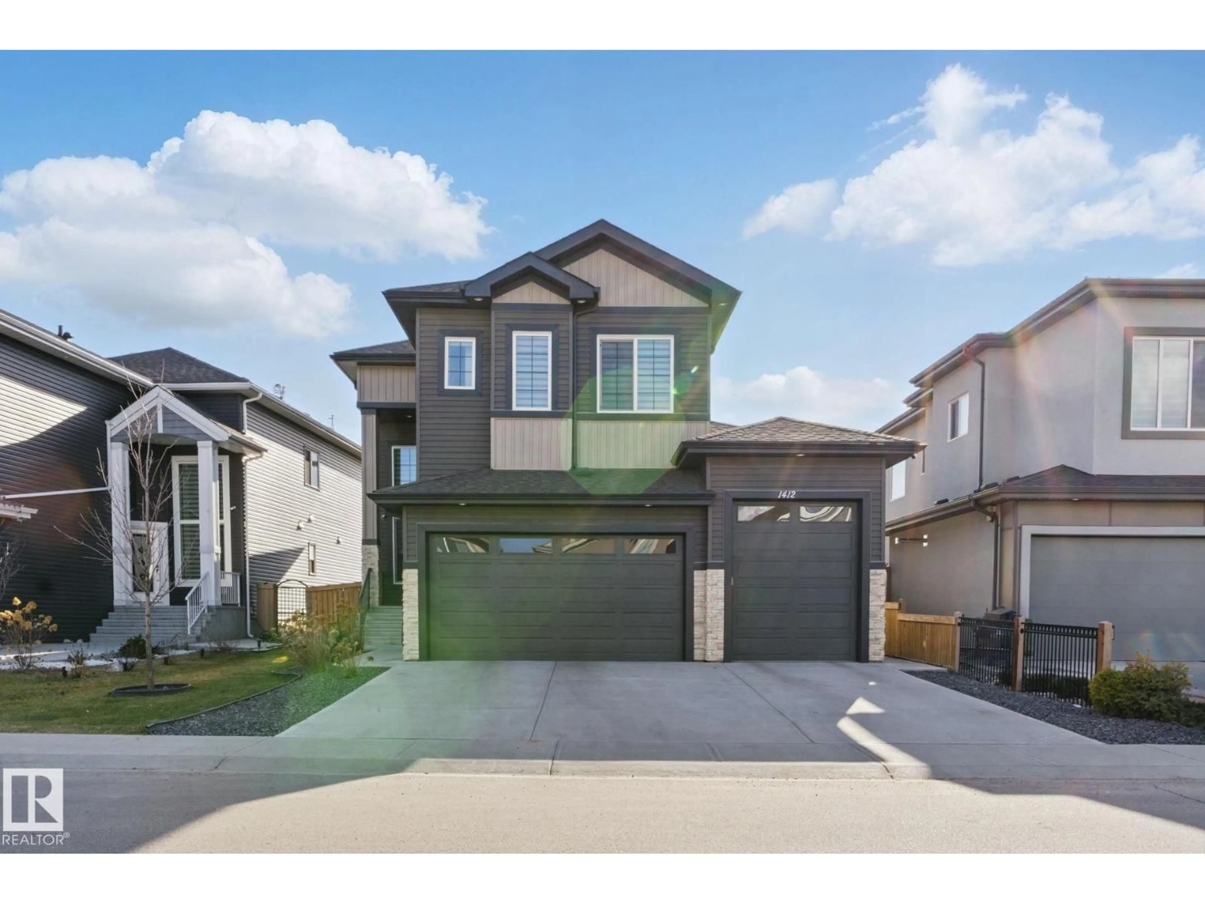 Home with vinyl exterior material, street for 1412 25 ST, Edmonton Alberta T6T2K7