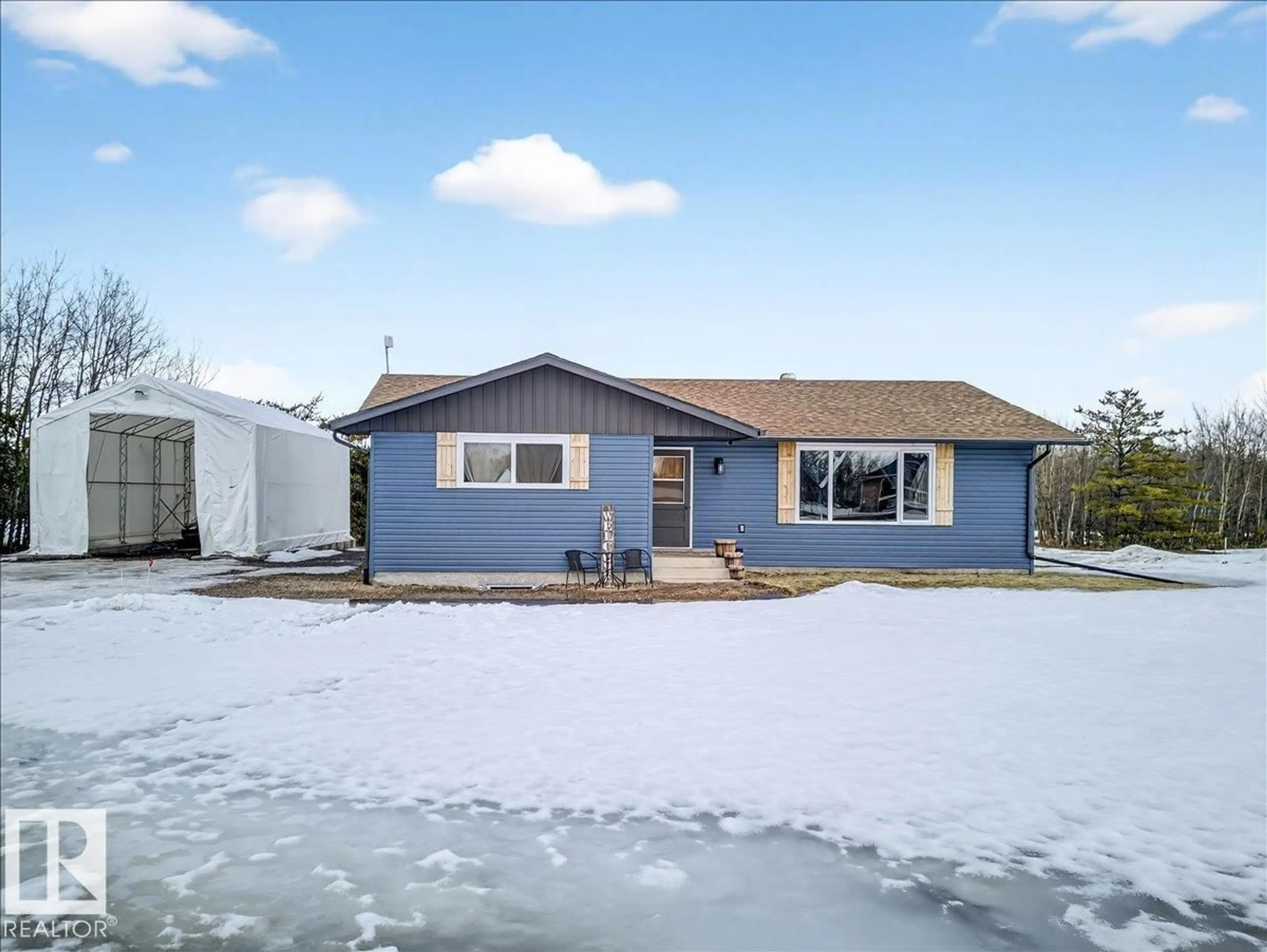 Home with vinyl exterior material, street for 58121 - 23 LILY LAKE ROAD, Rural Sturgeon County Alberta T0G1L2