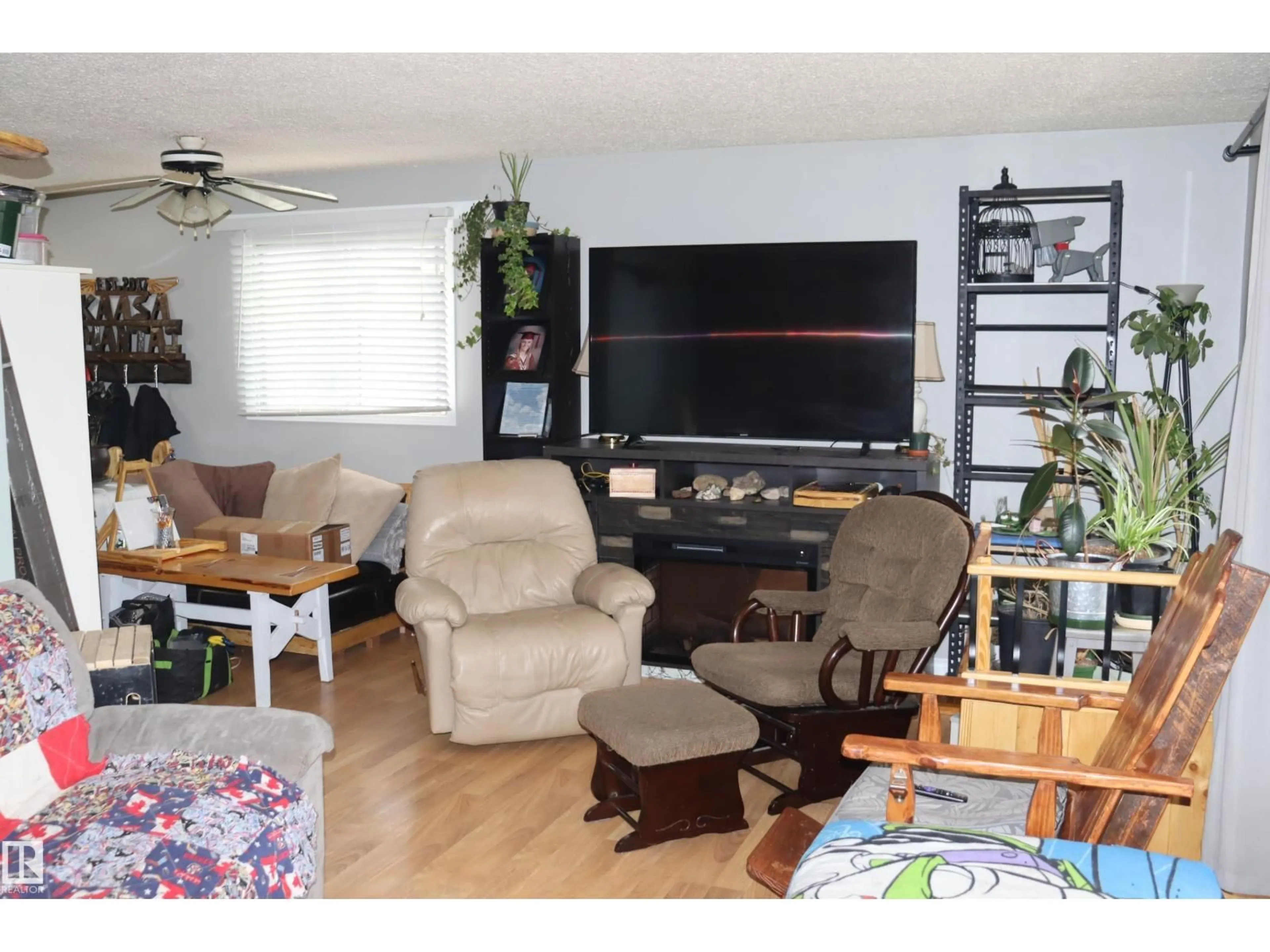 Living room with furniture, wood/laminate floor for 147 GARWOOD CR, Wetaskiwin Alberta T9A2X4