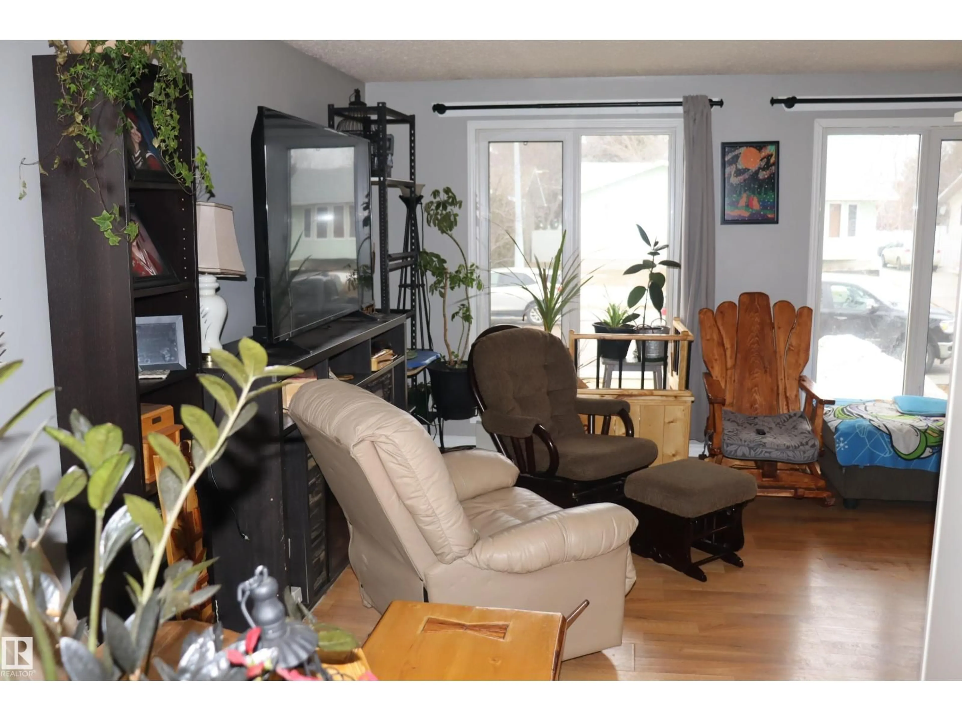 Living room with furniture, wood/laminate floor for 147 GARWOOD CR, Wetaskiwin Alberta T9A2X4