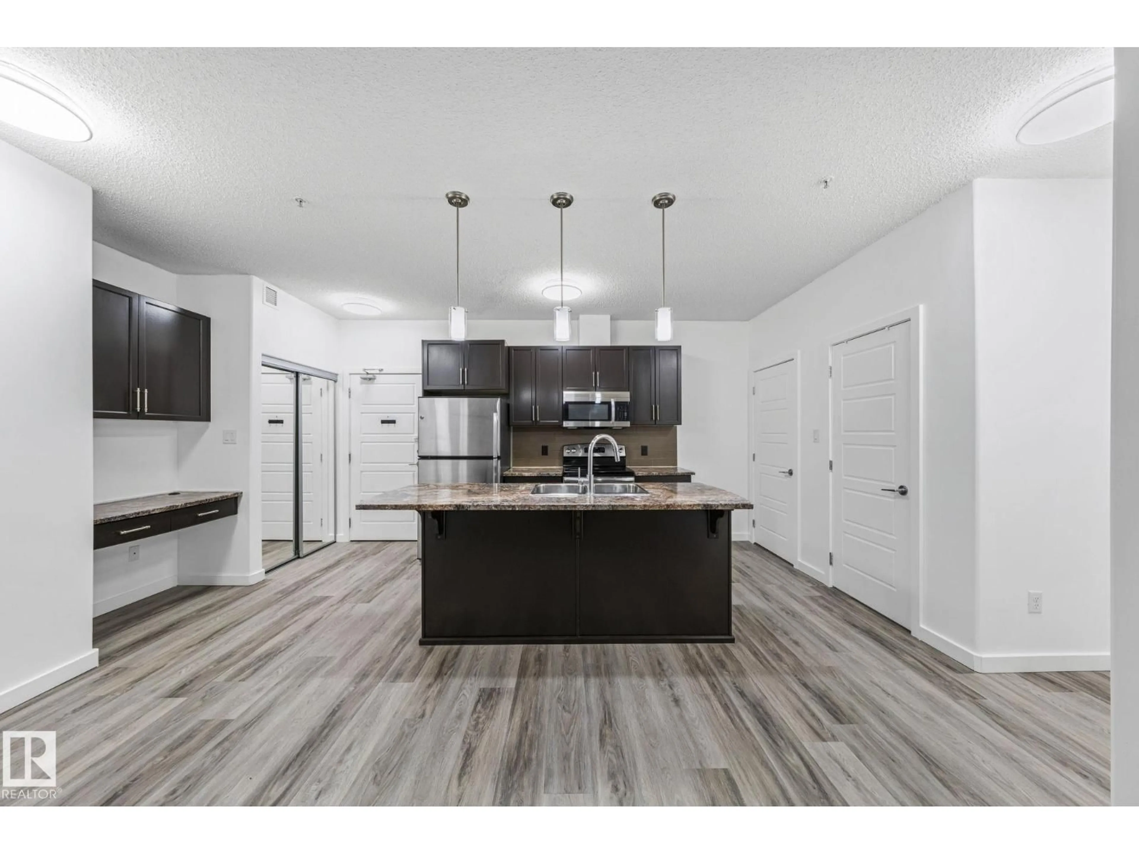 Open concept kitchen, unknown for 320 - 119 AMBLESIDE LINK LI, Edmonton Alberta T6W2Z9