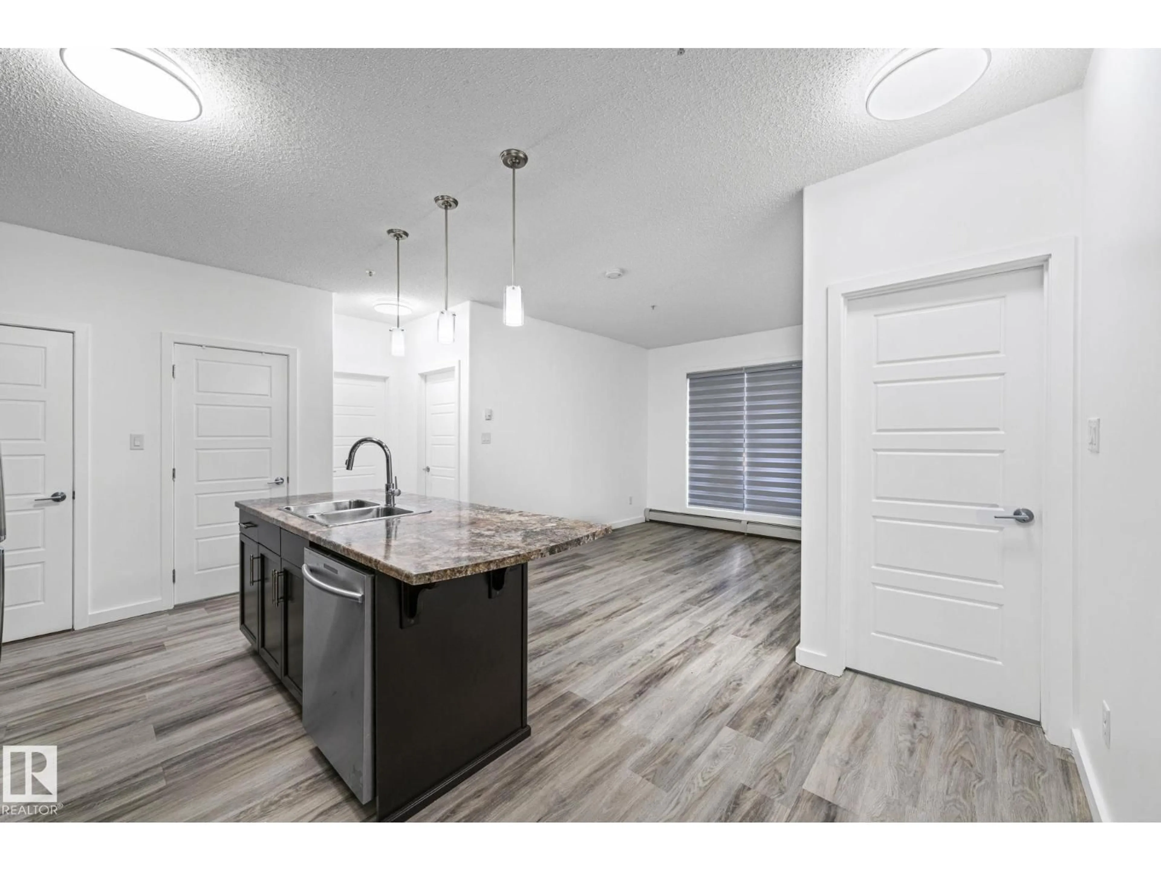 Open concept kitchen, unknown for 320 - 119 AMBLESIDE LINK LI, Edmonton Alberta T6W2Z9