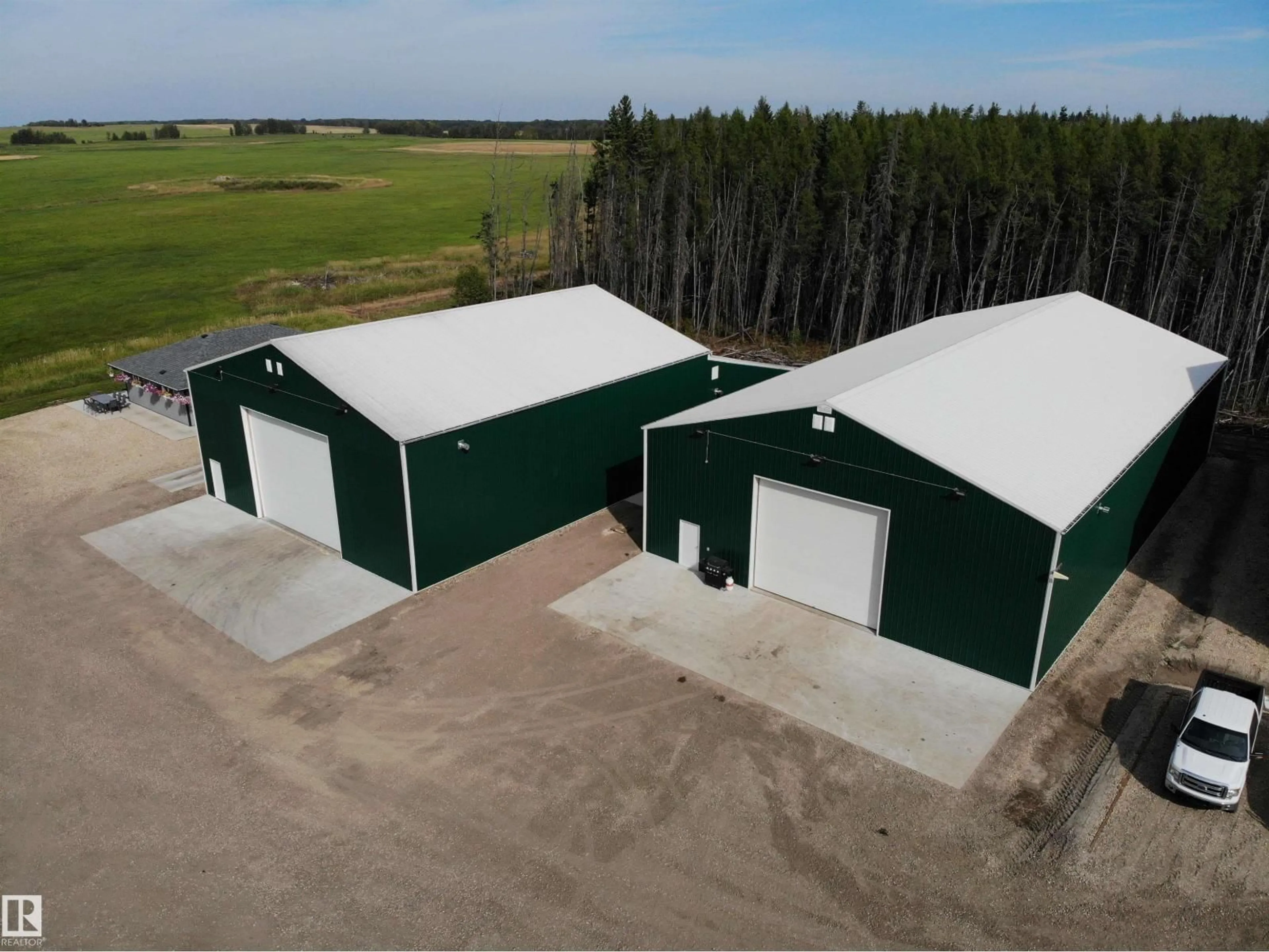 A pic from outside/outdoor area/front of a property/back of a property/a pic from drone, building for 33 HIGHWAY, Rural Barrhead County Alberta T7N1N2
