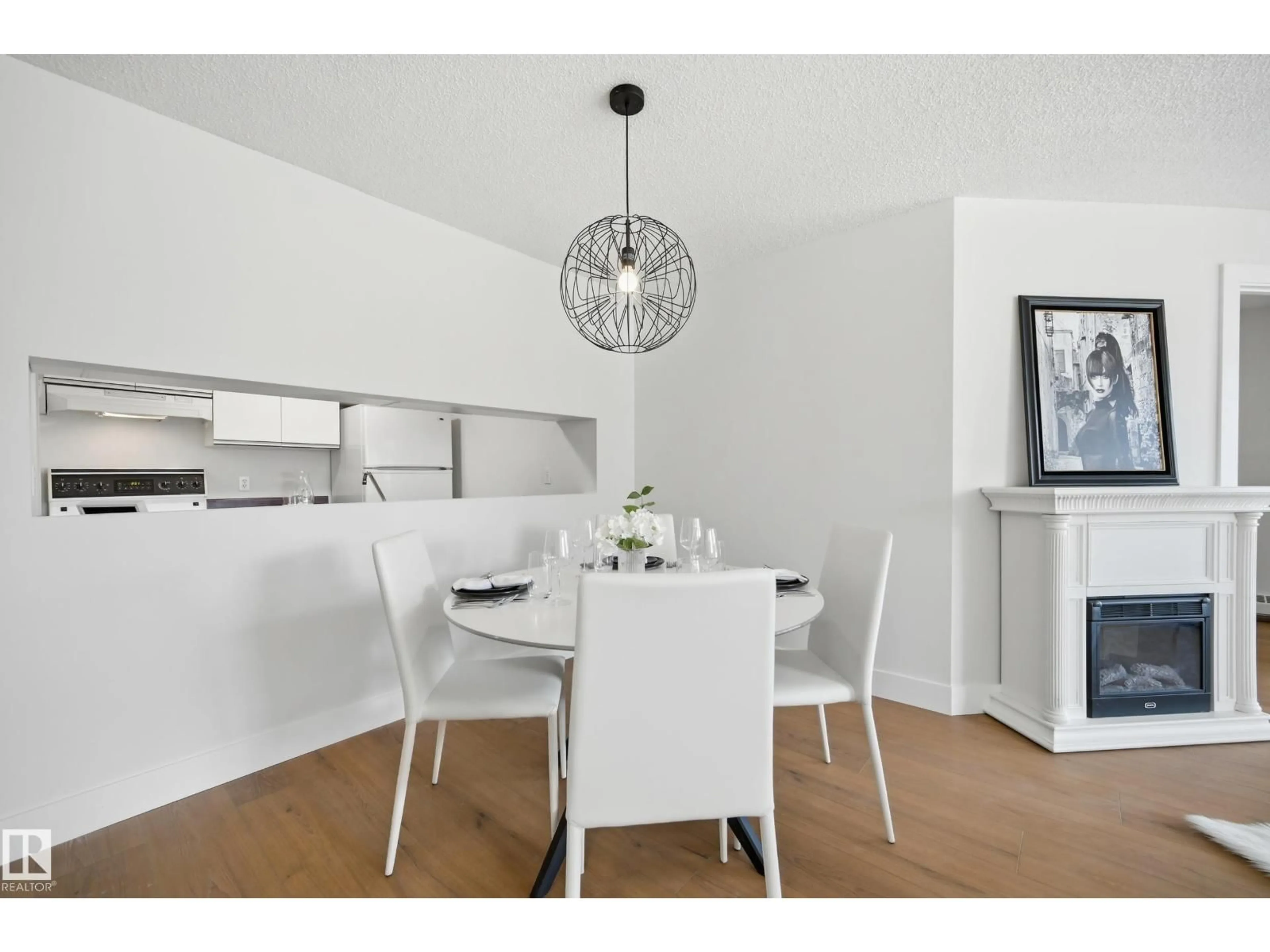 Dining room, wood/laminate floor for #102 - 9620 174 ST, Edmonton Alberta T5T6B9