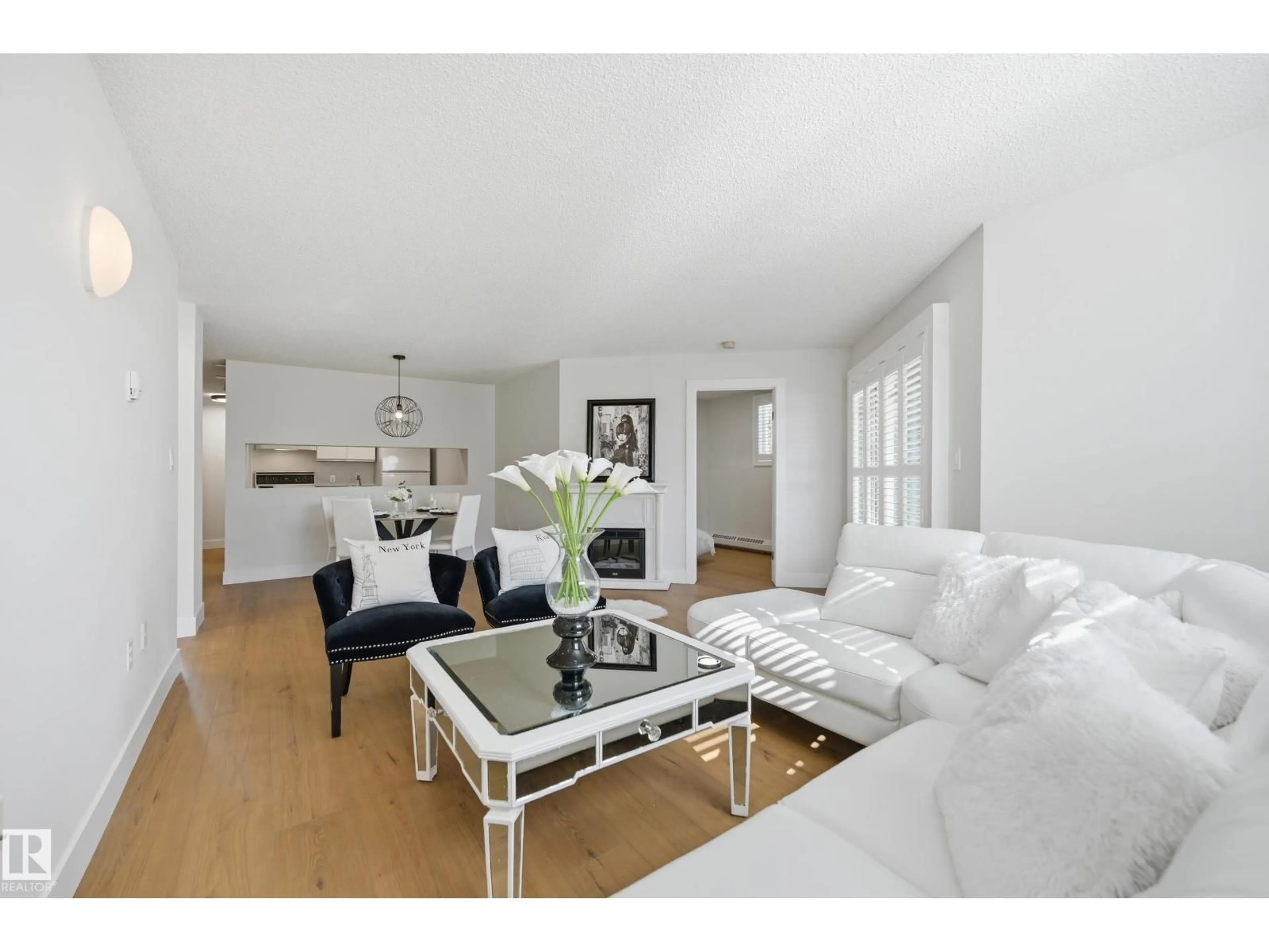 Living room with furniture, wood/laminate floor for #102 - 9620 174 ST, Edmonton Alberta T5T6B9
