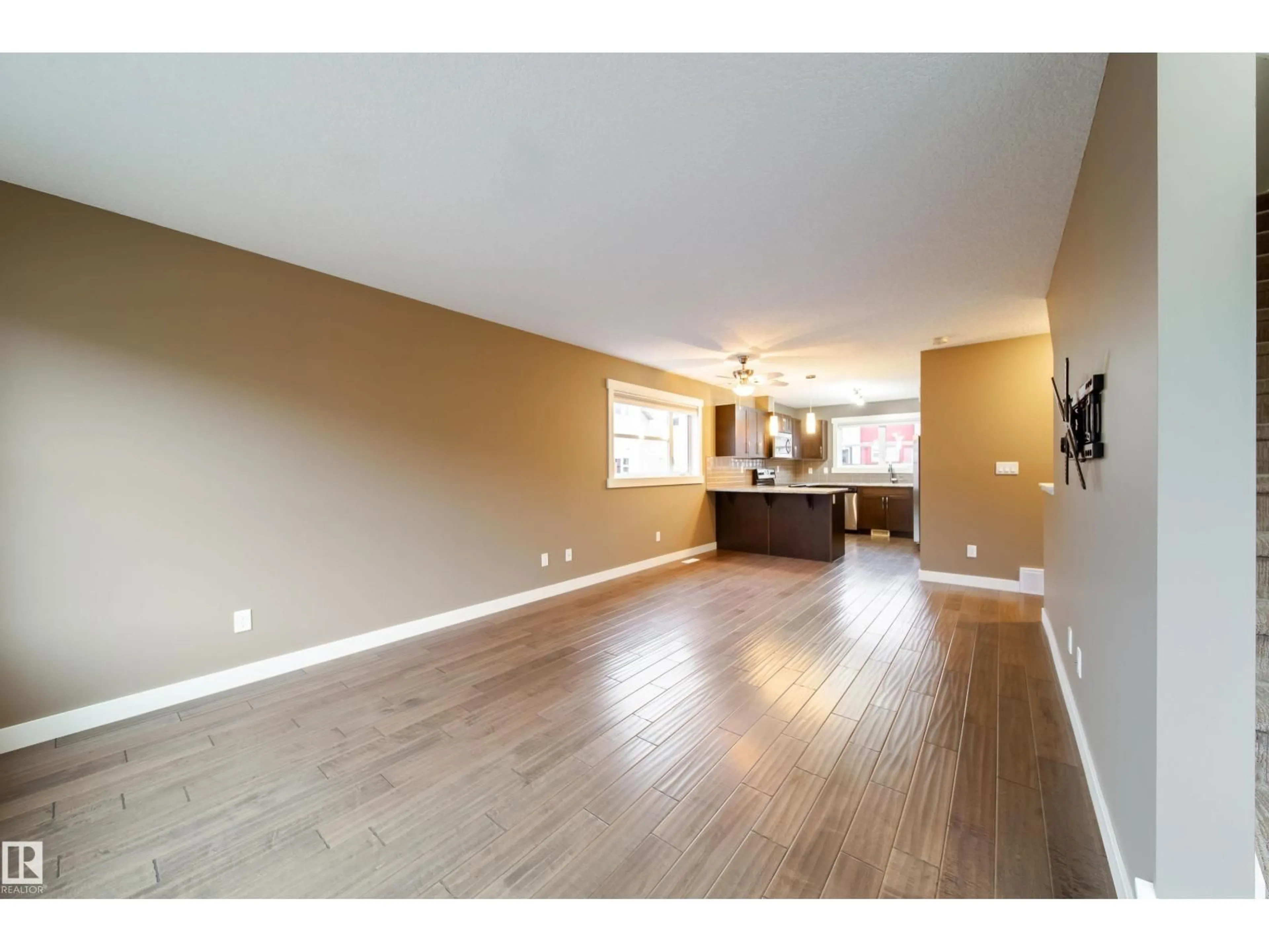 Open concept kitchen, wood/laminate floor for 401 - 122 SOUTHFORK DR, Leduc Alberta T9E0X1