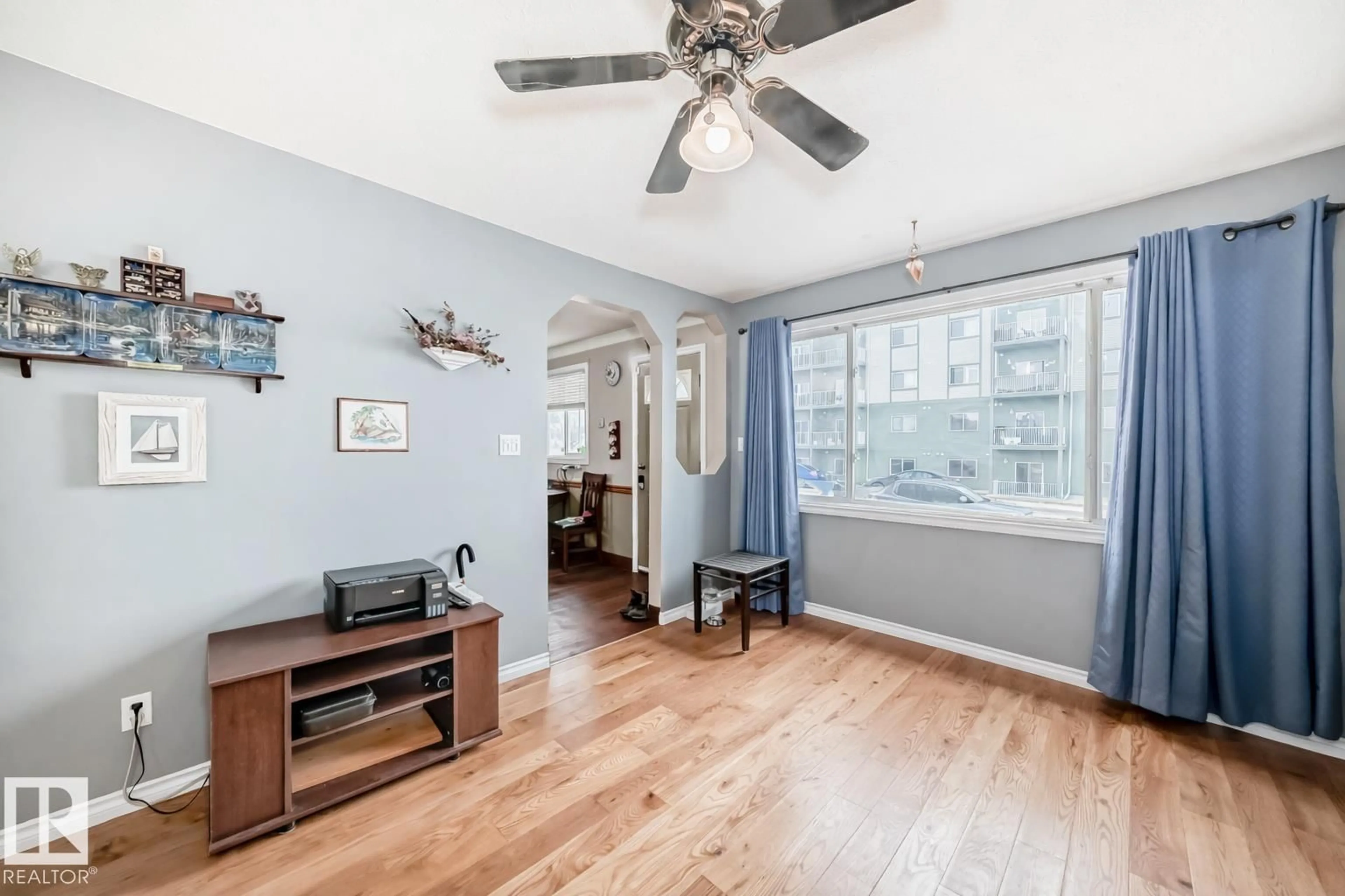 Living room with furniture, wood/laminate floor for 4710 56 AV, Bruderheim Alberta T0B0S0