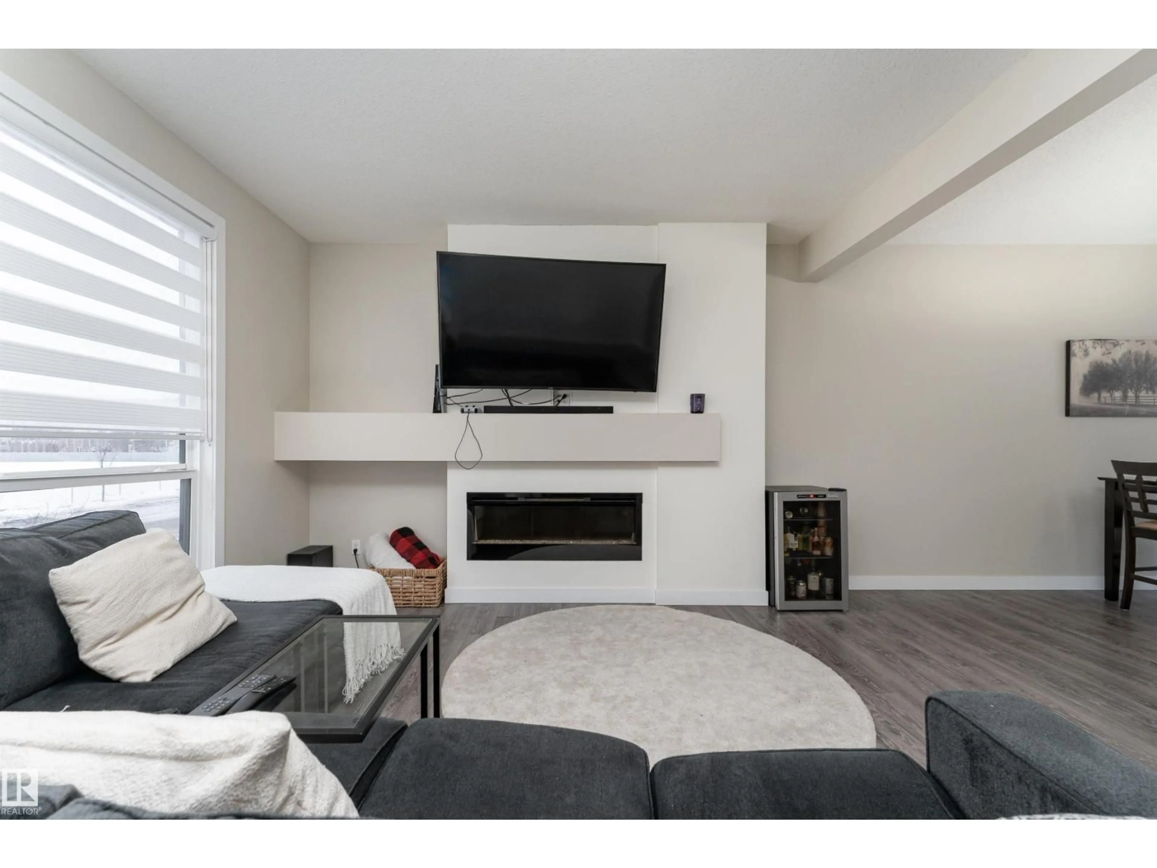 Living room with furniture, wood/laminate floor for 14709 125 STREET ST, Edmonton Alberta T5X0G8