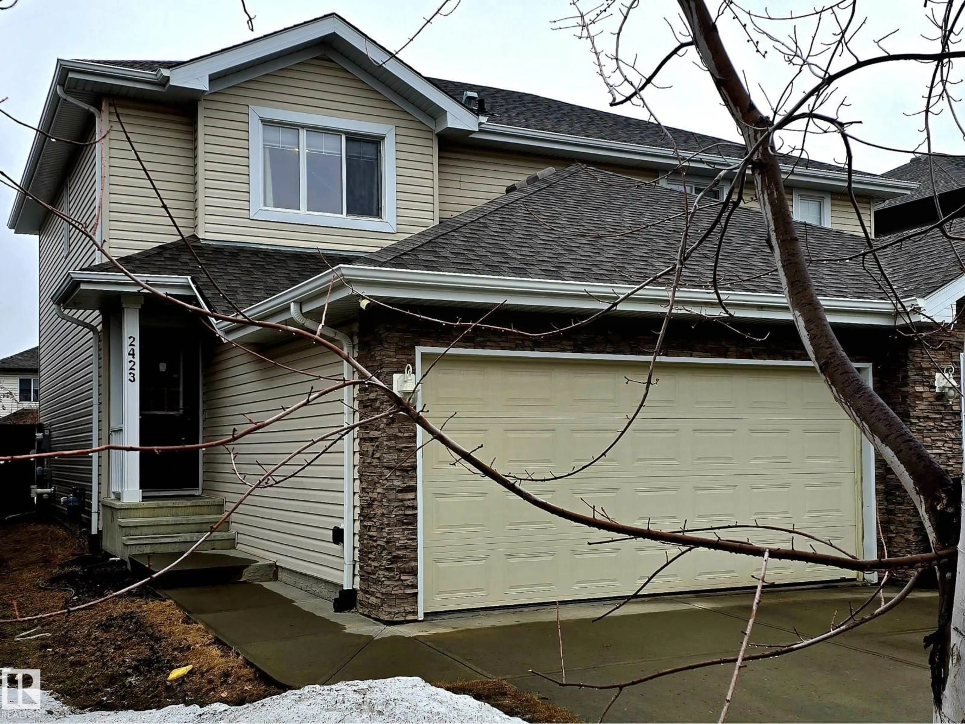 Home with vinyl exterior material, street for 2423 CASSELMAN CR, Edmonton Alberta T6W0W2