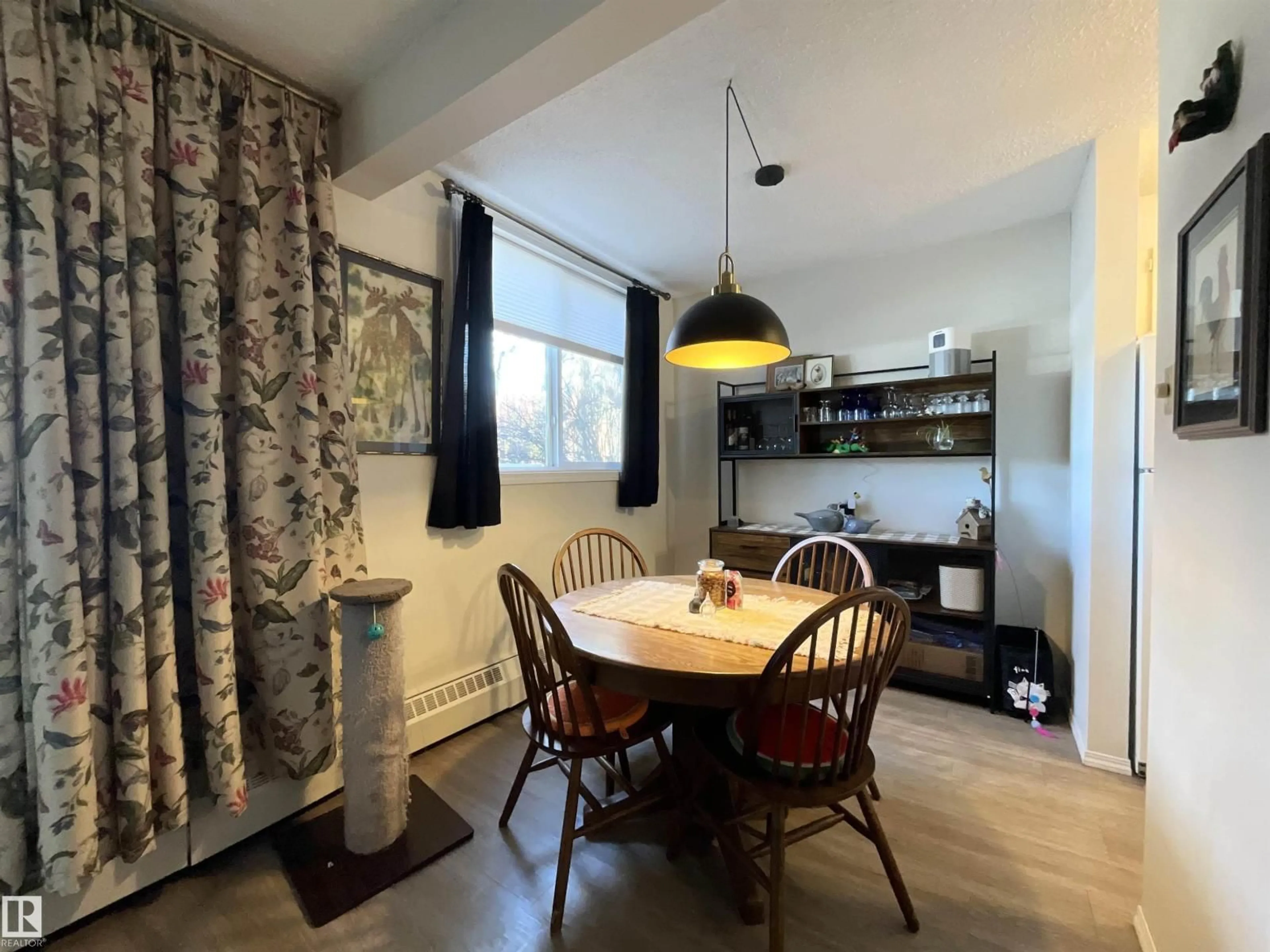 Dining room, wood/laminate floor for #101 - 11019 107 ST, Edmonton Alberta T5H2Z6