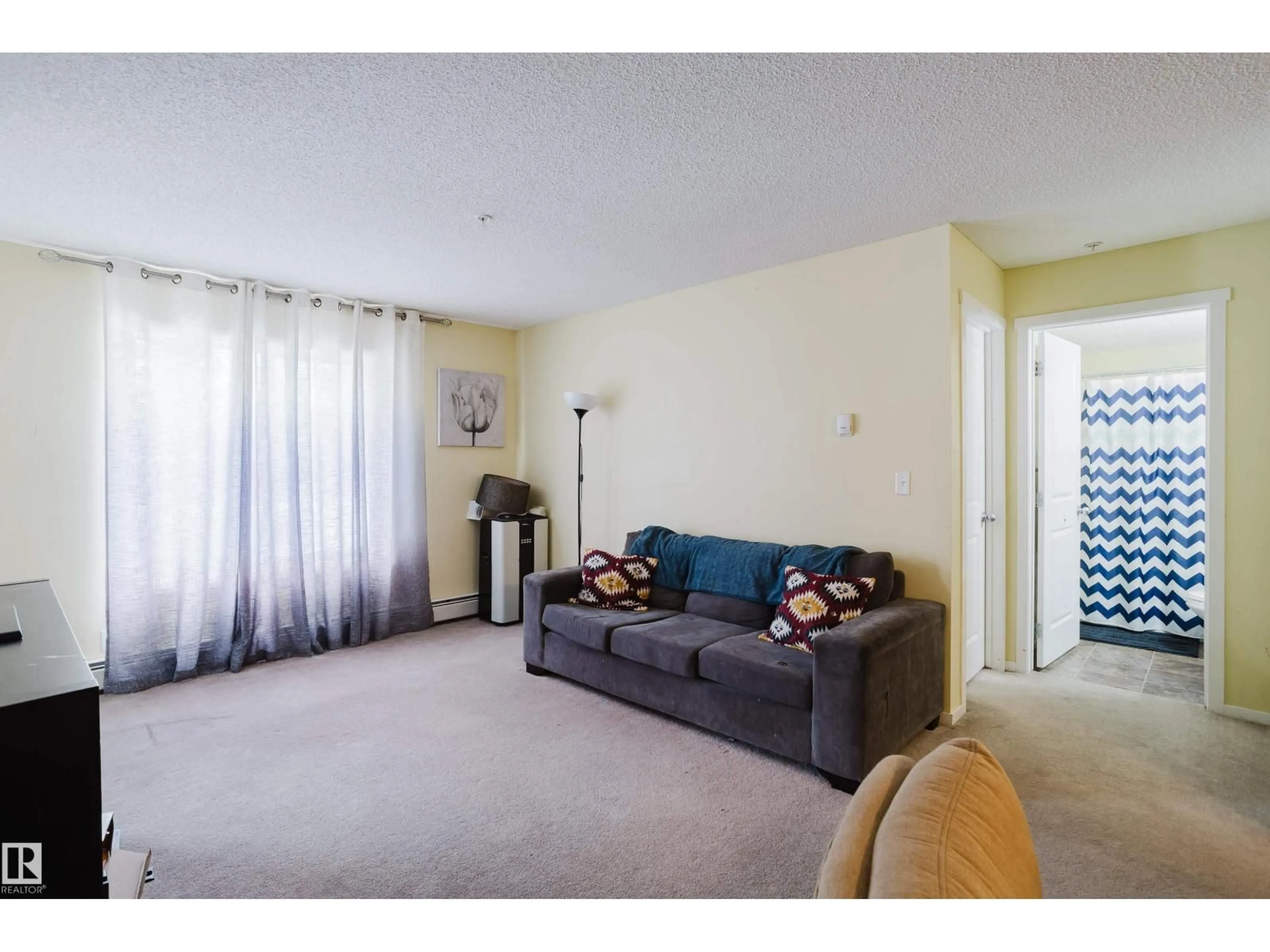 Living room with furniture, carpet floor for 1510 - 119 WATT DR, Edmonton Alberta T6X2E6