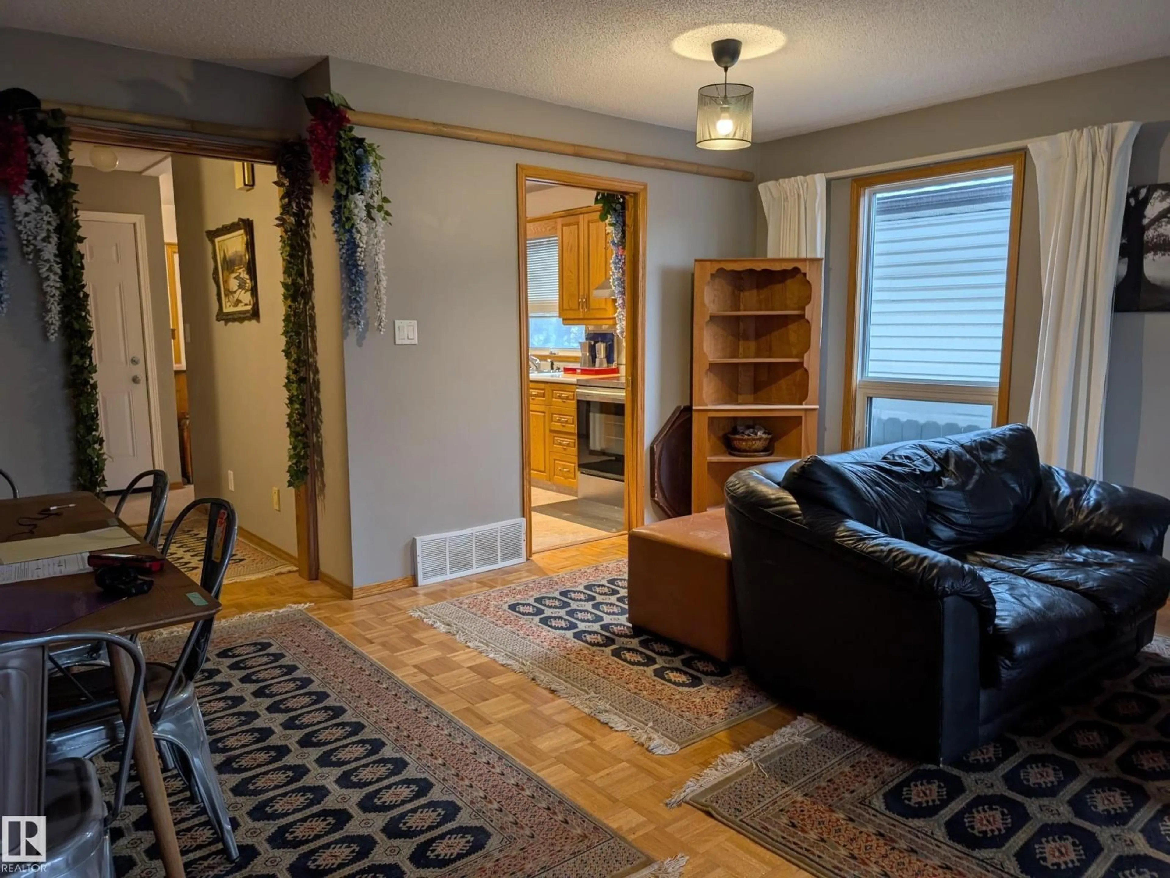 Living room with furniture, unknown for 10645 65 AV, Edmonton Alberta T6H1V5