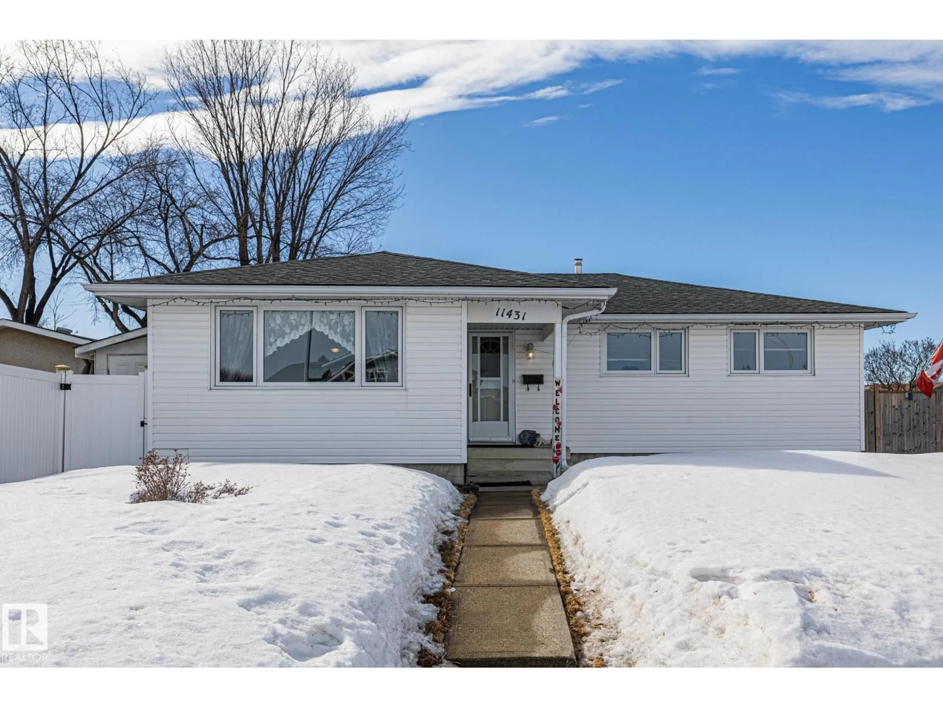 Home with vinyl exterior material, street for NW - 11431 149 AV, Edmonton Alberta T5X1B9