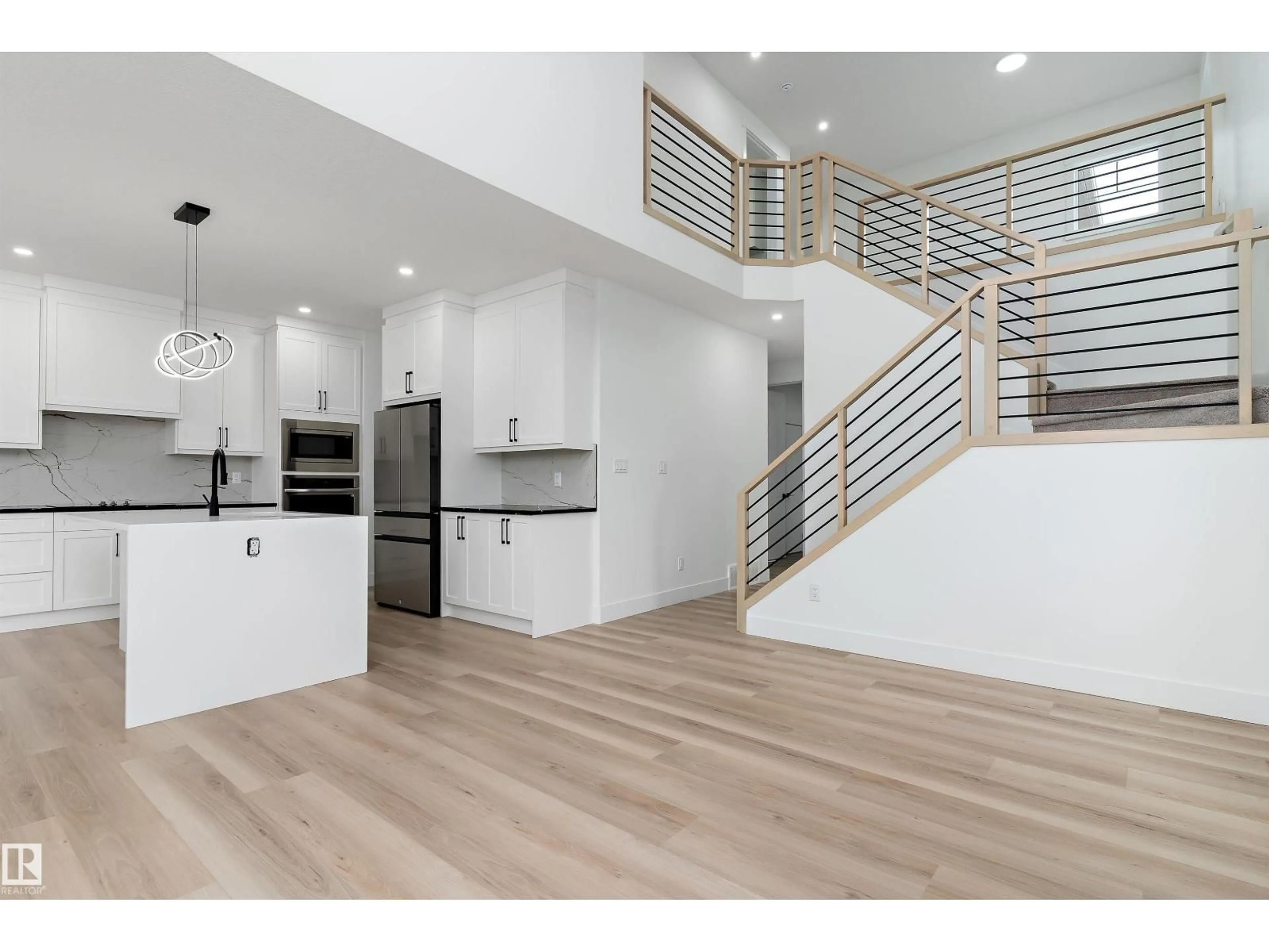 Open concept kitchen, wood/laminate floor for 804 ELDERBERRY CT, Edmonton Alberta T6M3J7