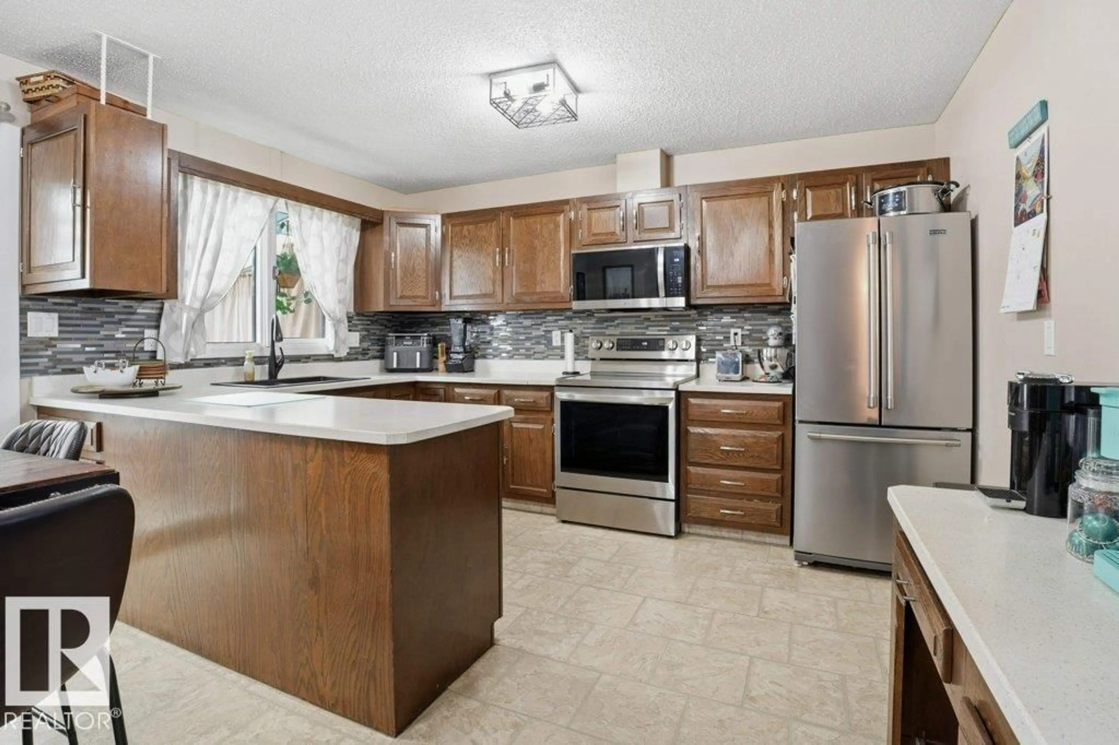 Open concept kitchen, ceramic/tile floor for 5119 51 ST, Legal Alberta T0G1L0
