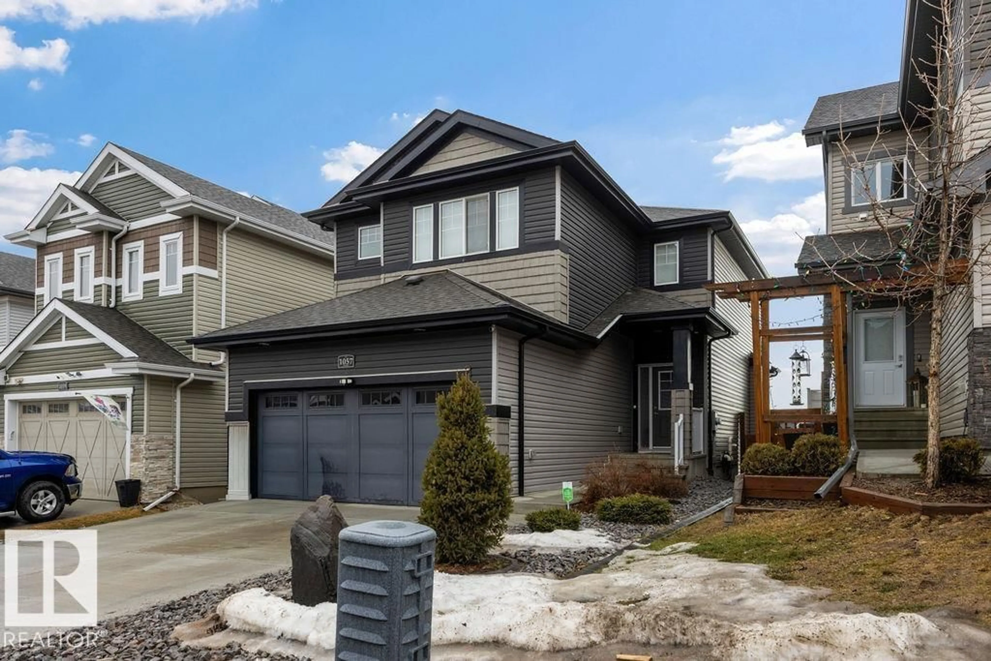 Home with vinyl exterior material, street for 1057 COOPERS HAWK LINK, Edmonton Alberta T5S0M2