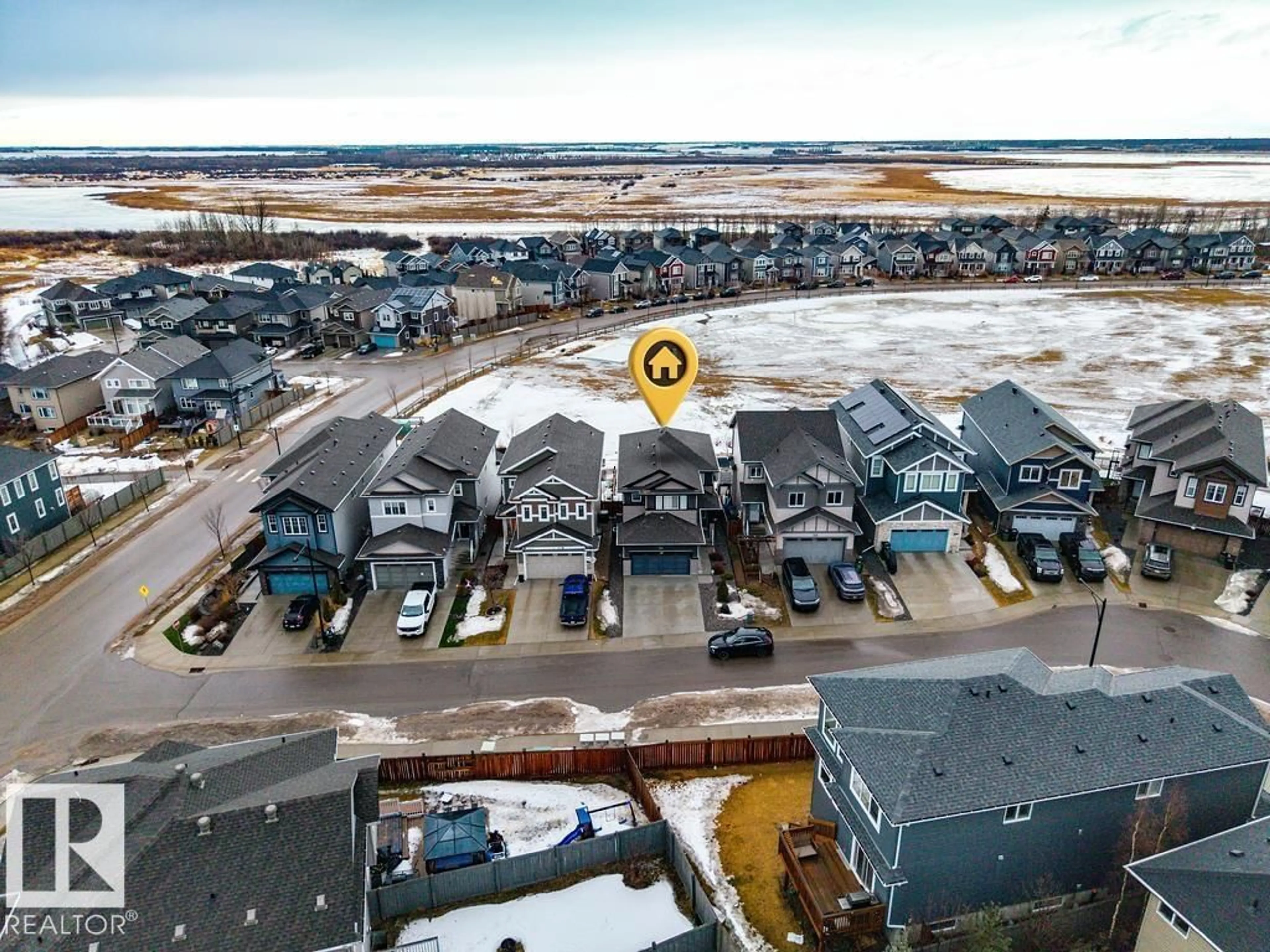 A pic from outside/outdoor area/front of a property/back of a property/a pic from drone, water/lake/river/ocean view for 1057 COOPERS HAWK LINK, Edmonton Alberta T5S0M2