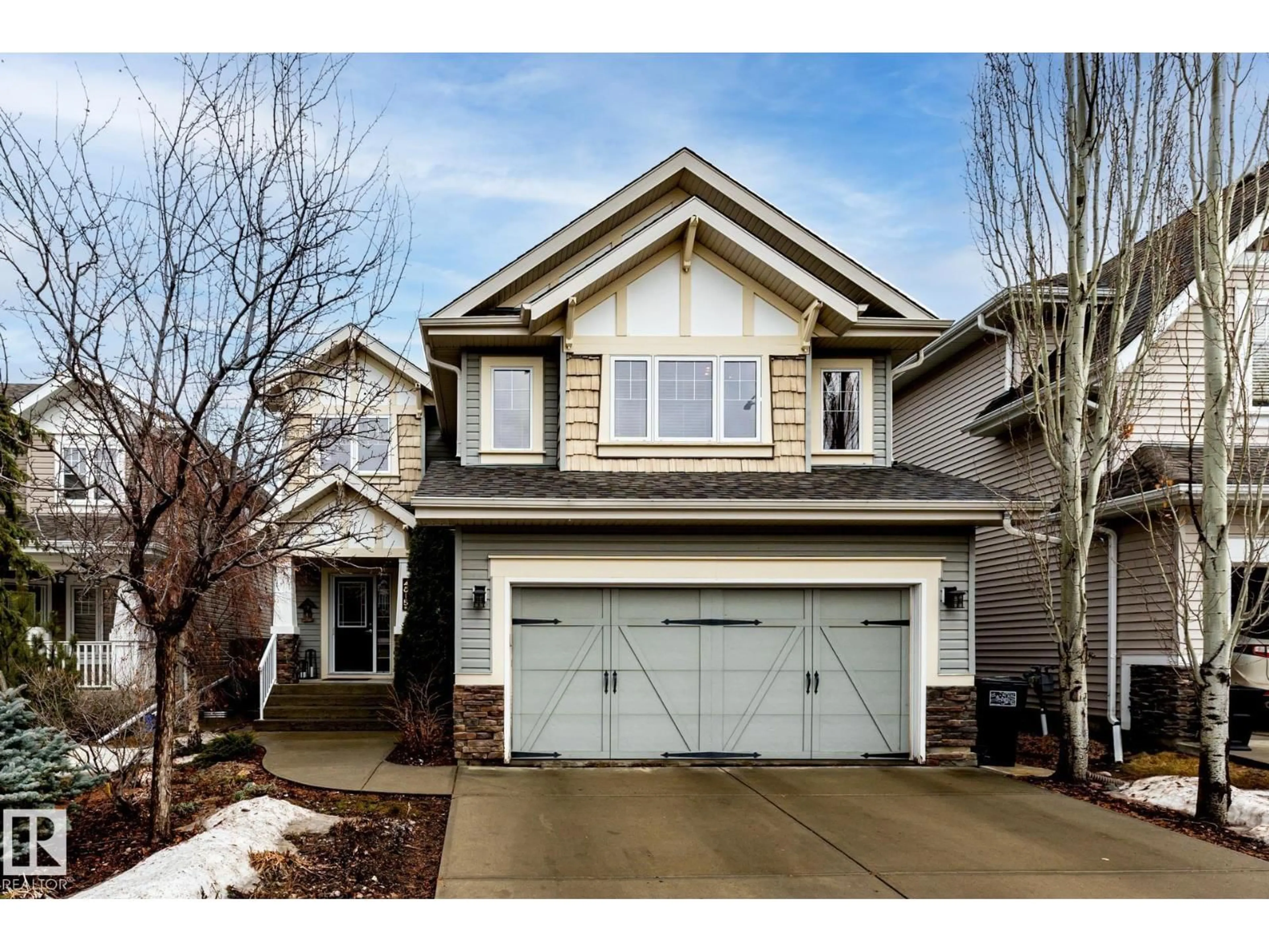 Home with vinyl exterior material, street for NW - 4815 209 ST, Edmonton Alberta T6M3A4