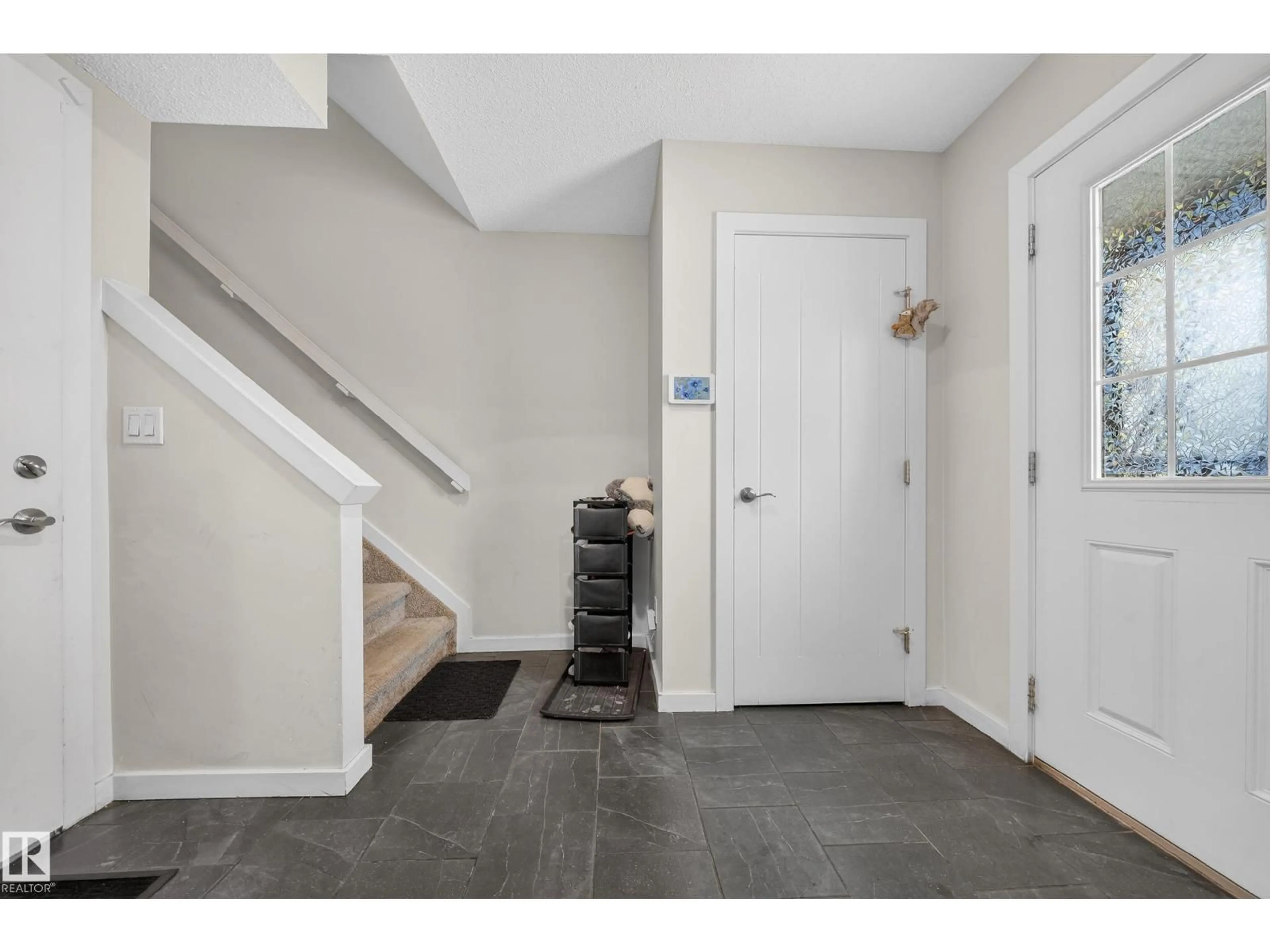 Indoor entryway for #11 - 3025 151 AV, Edmonton Alberta T5Y3W4