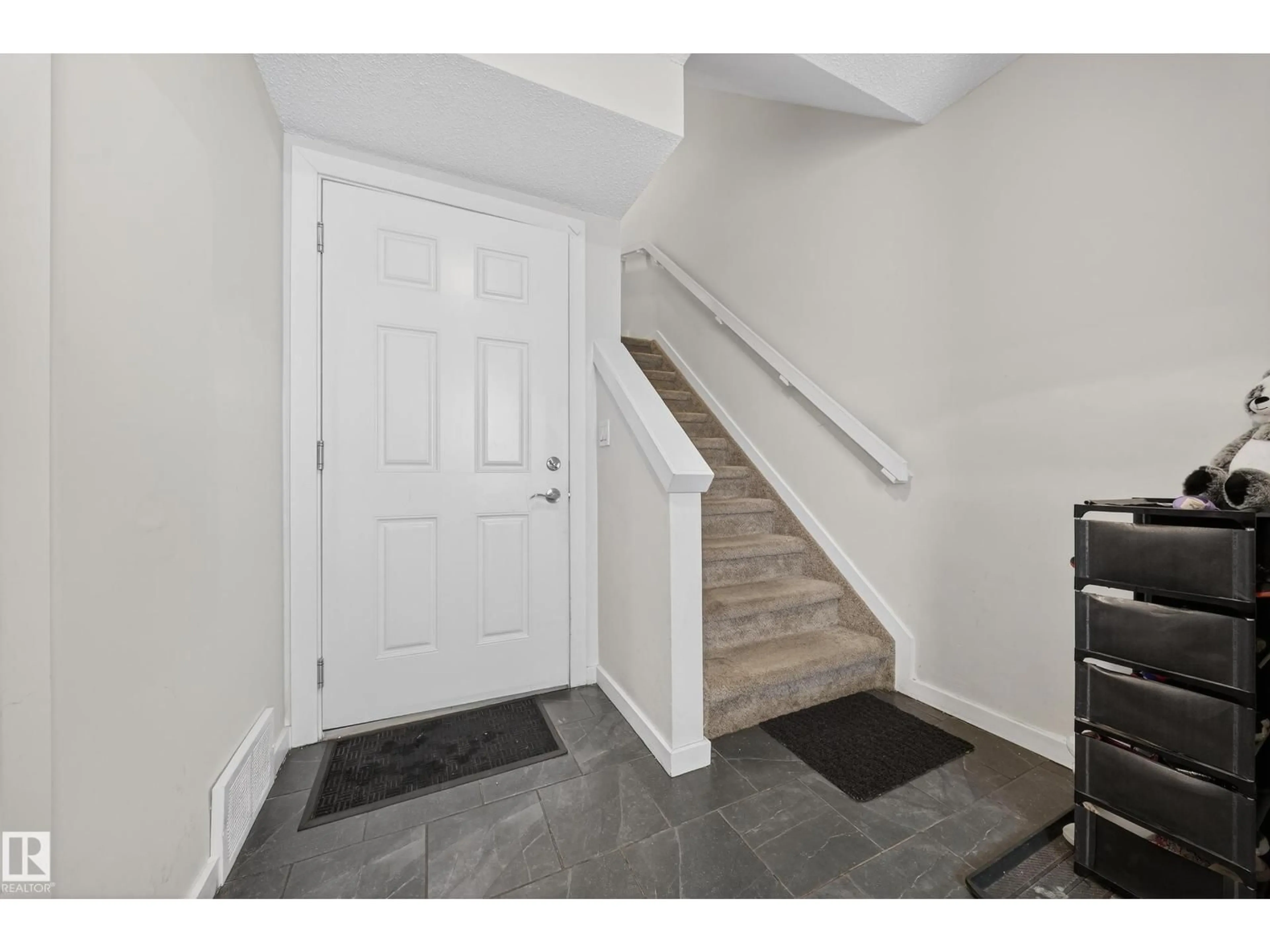 Indoor entryway for #11 - 3025 151 AV, Edmonton Alberta T5Y3W4