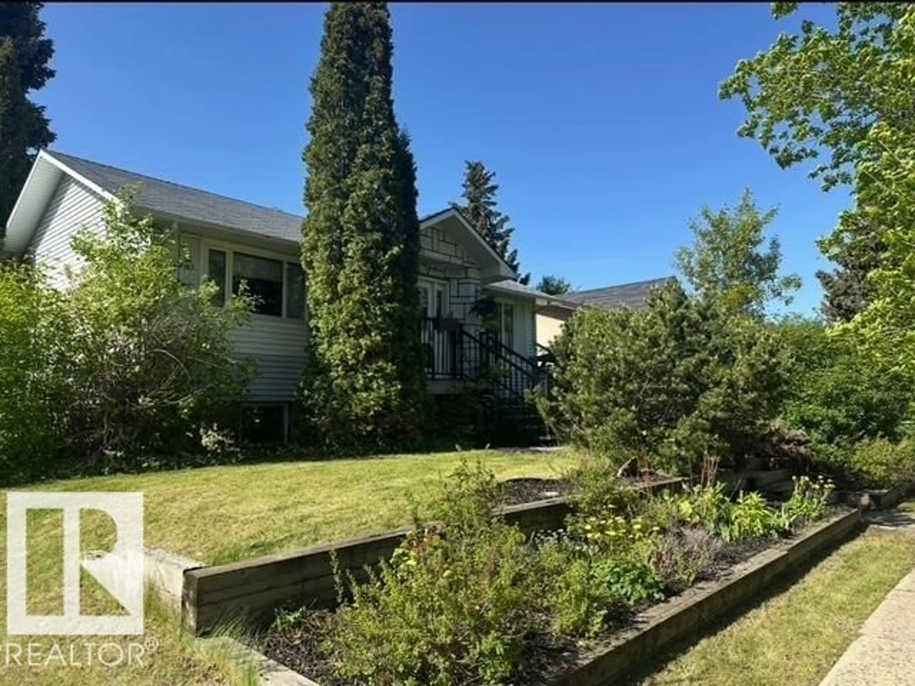 A pic from outside/outdoor area/front of a property/back of a property/a pic from drone, mountain view for 3815 115 AV, Edmonton Alberta T5W0V2