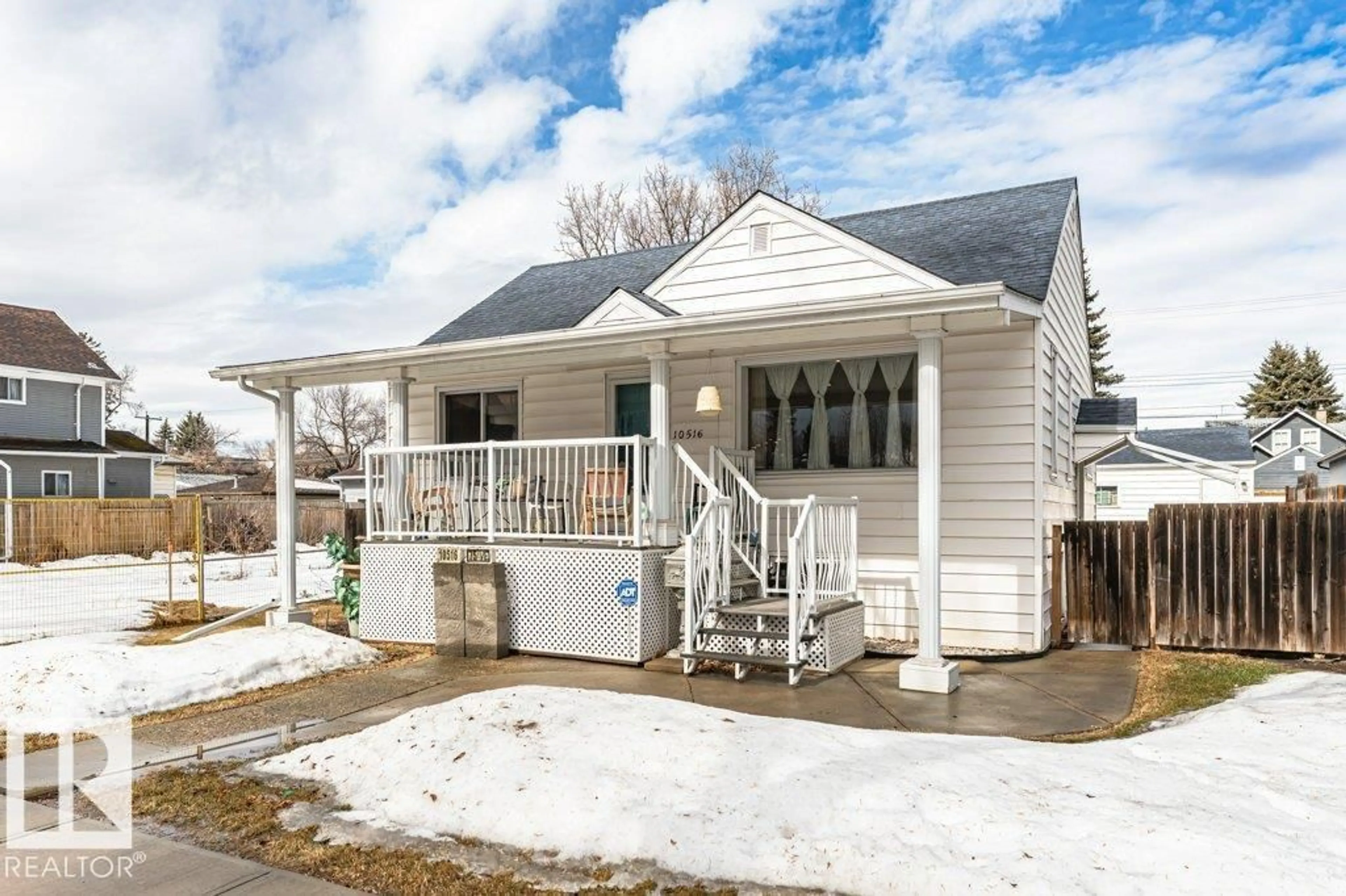 Home with vinyl exterior material, street for 10516 75 AV, Edmonton Alberta T6E1J4